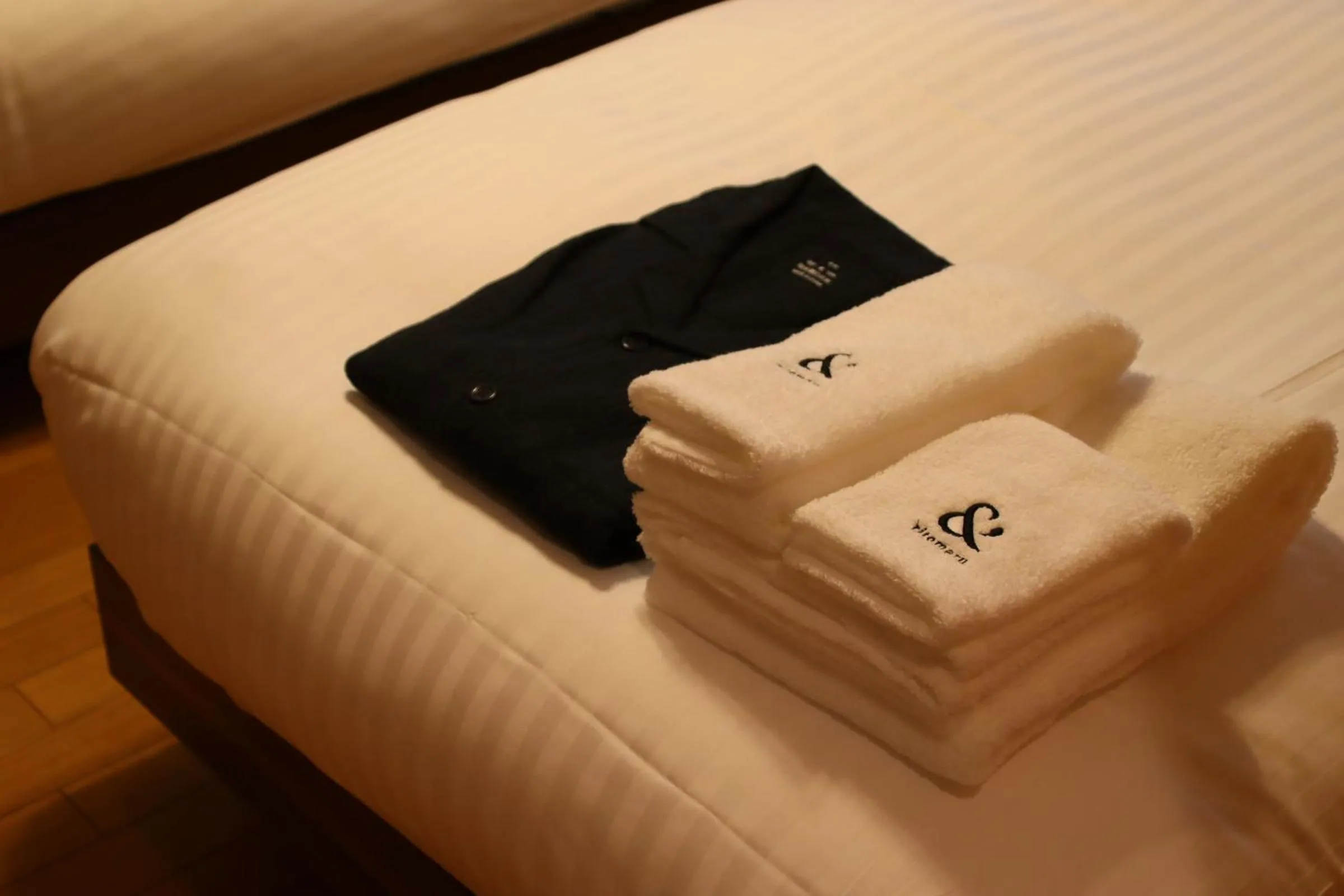 Bed in ritomaru rooms hakata hakozaki