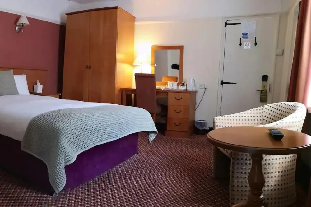 Bed in The Tudor Hotel