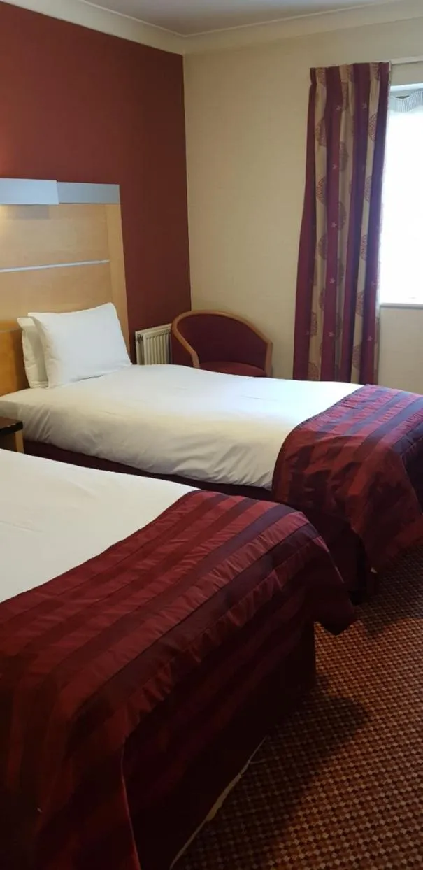 Bed in The Tudor Hotel