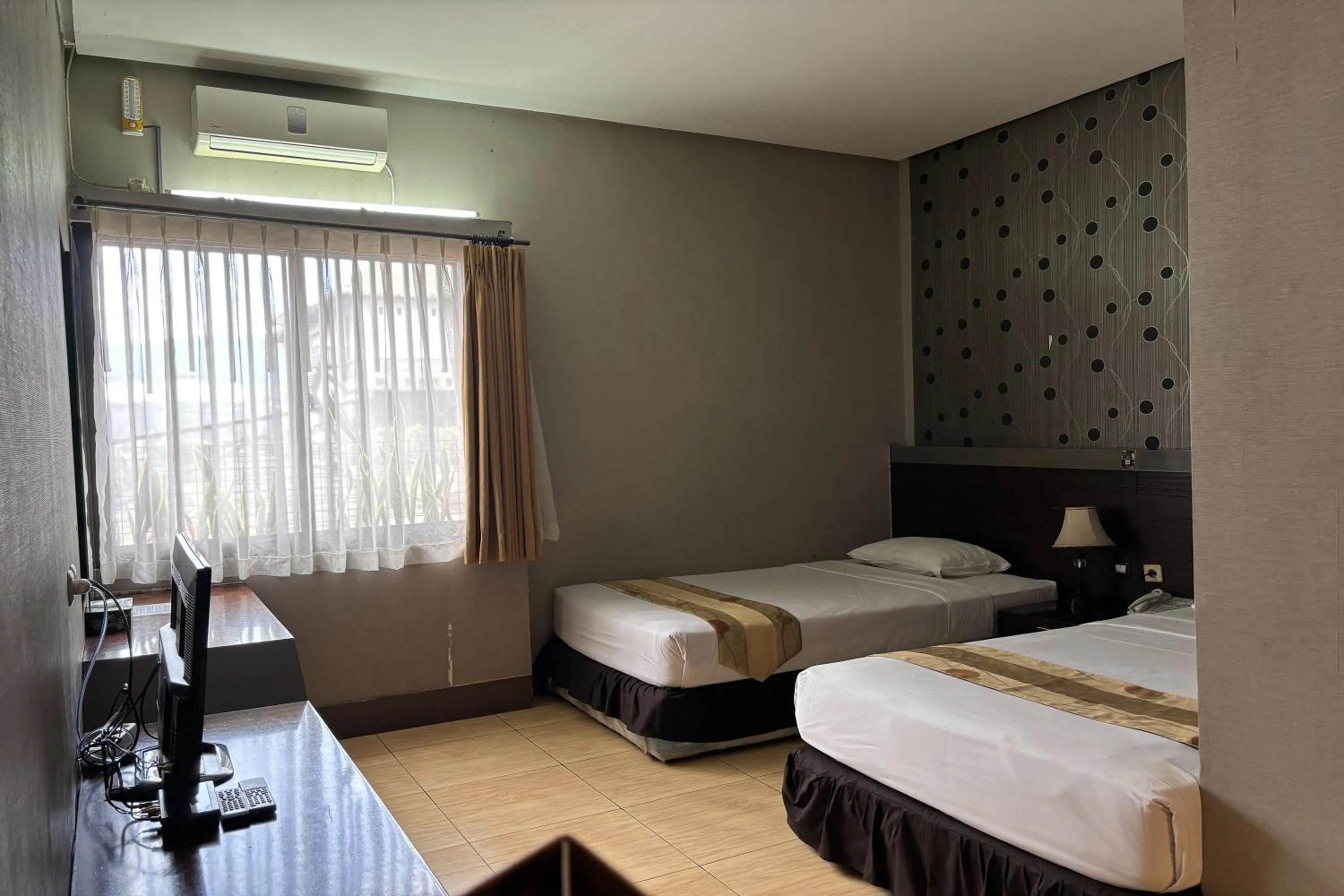 Bed in Hotel Pesona Bamboe Lembang