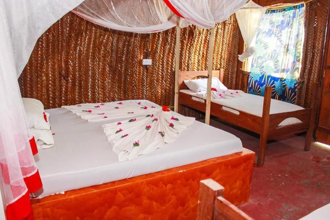 Bed in New Jambo Bungalows