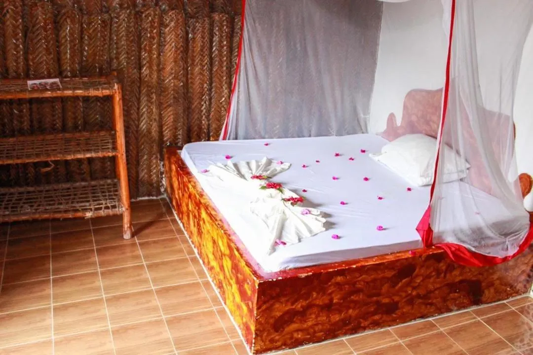 Bed in New Jambo Bungalows