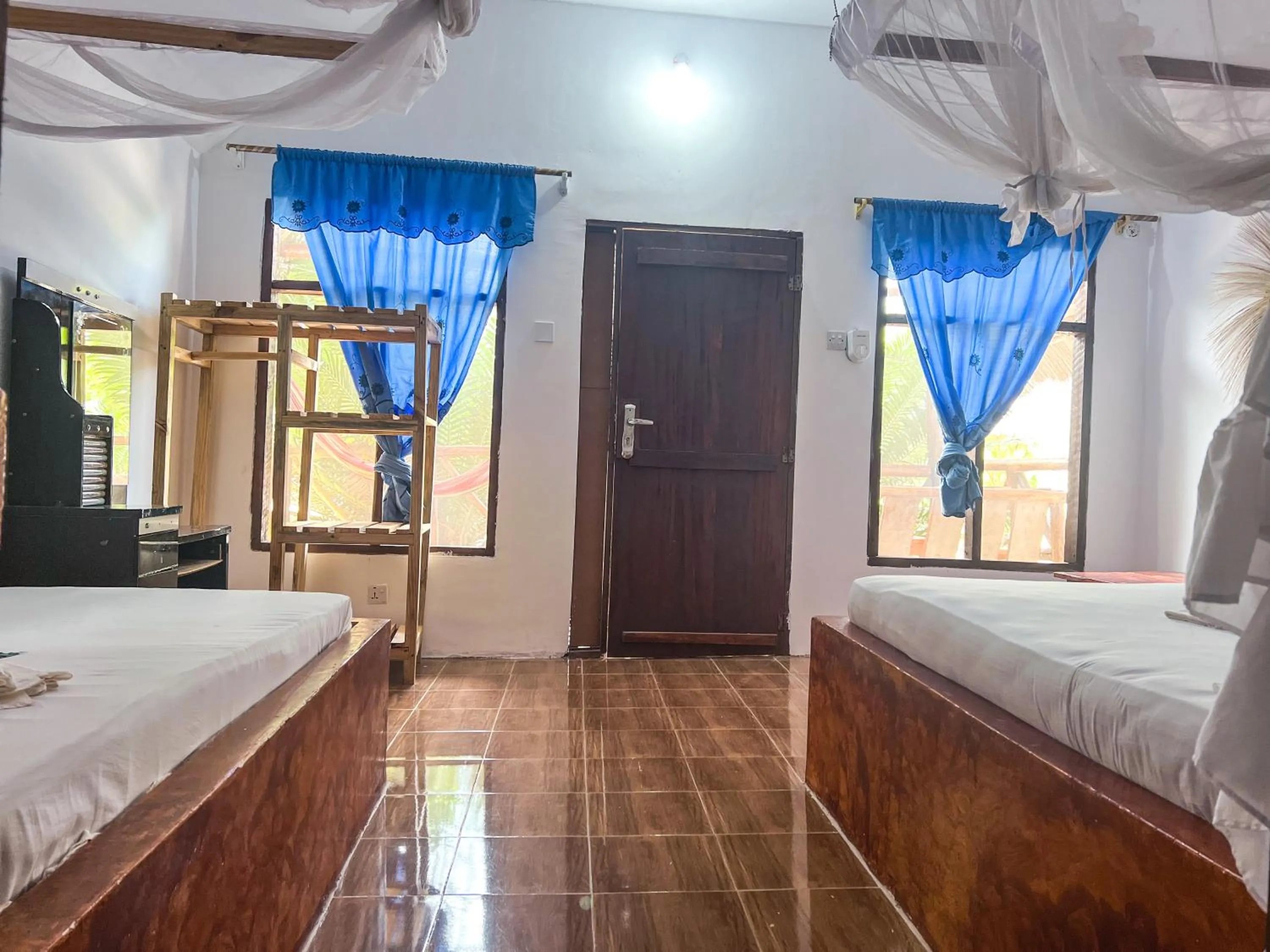 Bed in New Jambo Bungalows