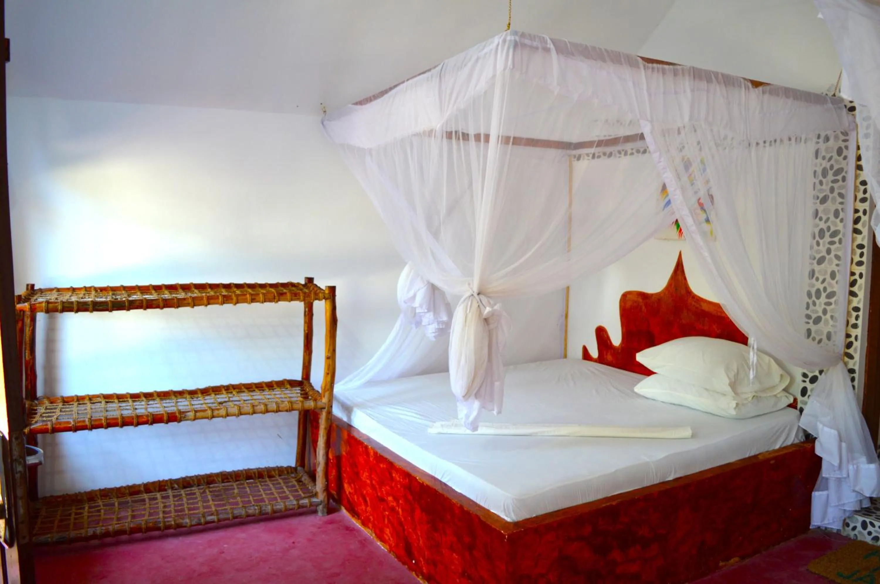 Bed in New Jambo Bungalows