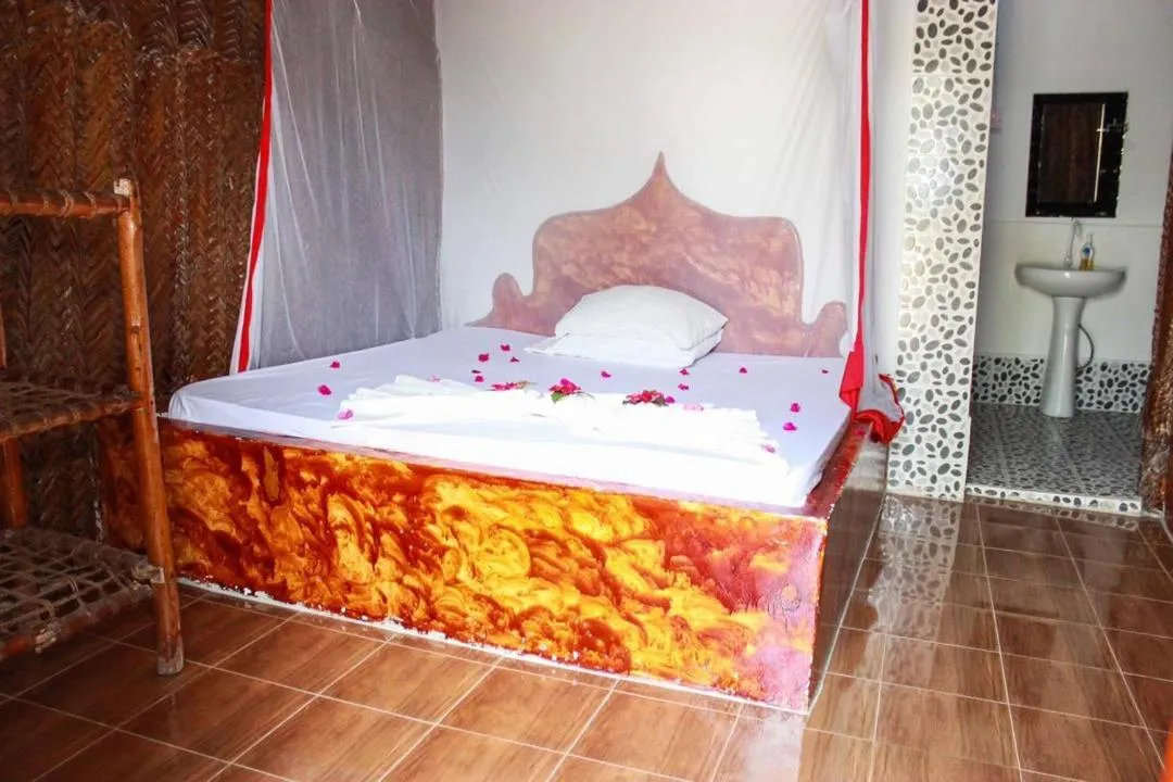 Bed in New Jambo Bungalows