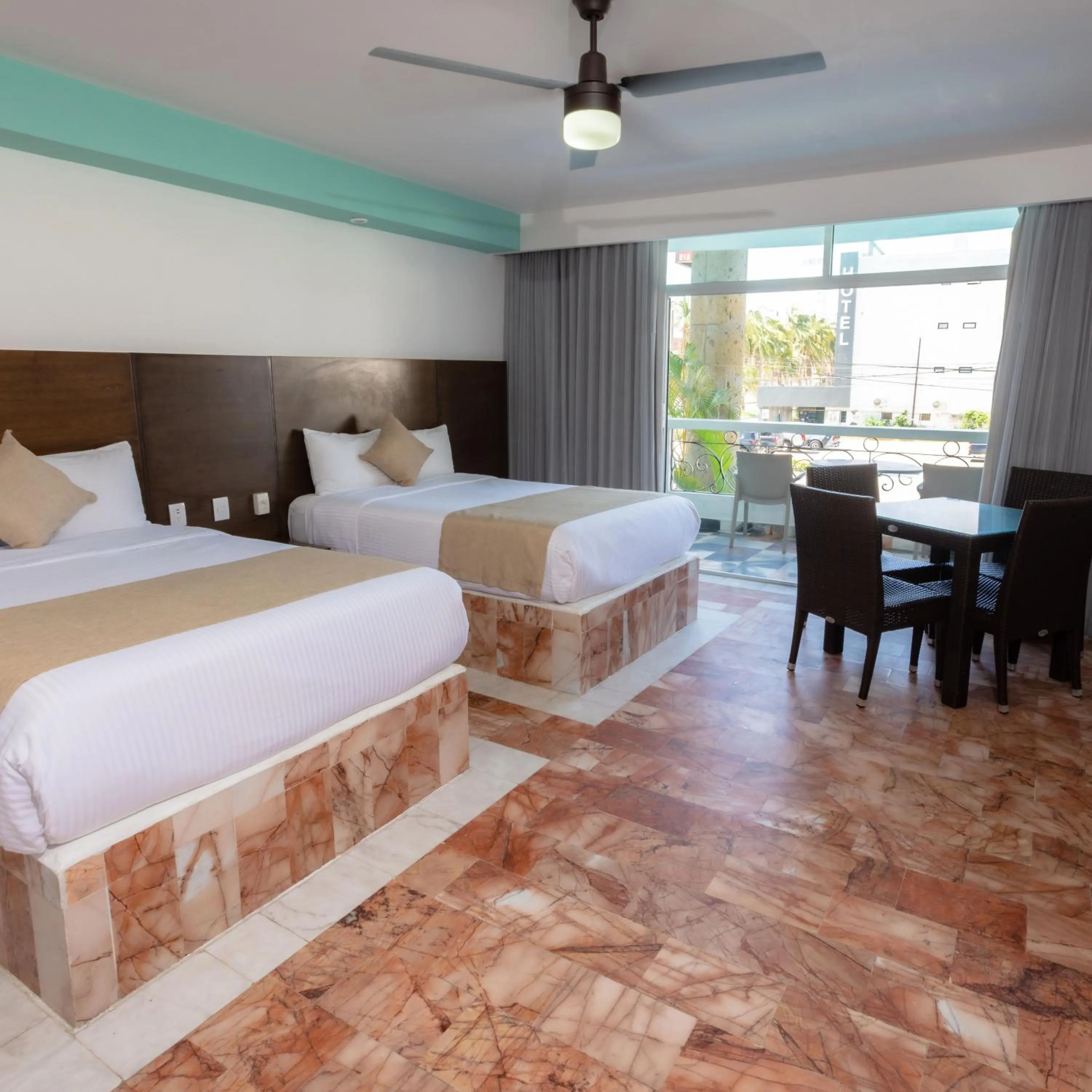 Photo of the whole room, Bed in Solamar Inn Mazatlan