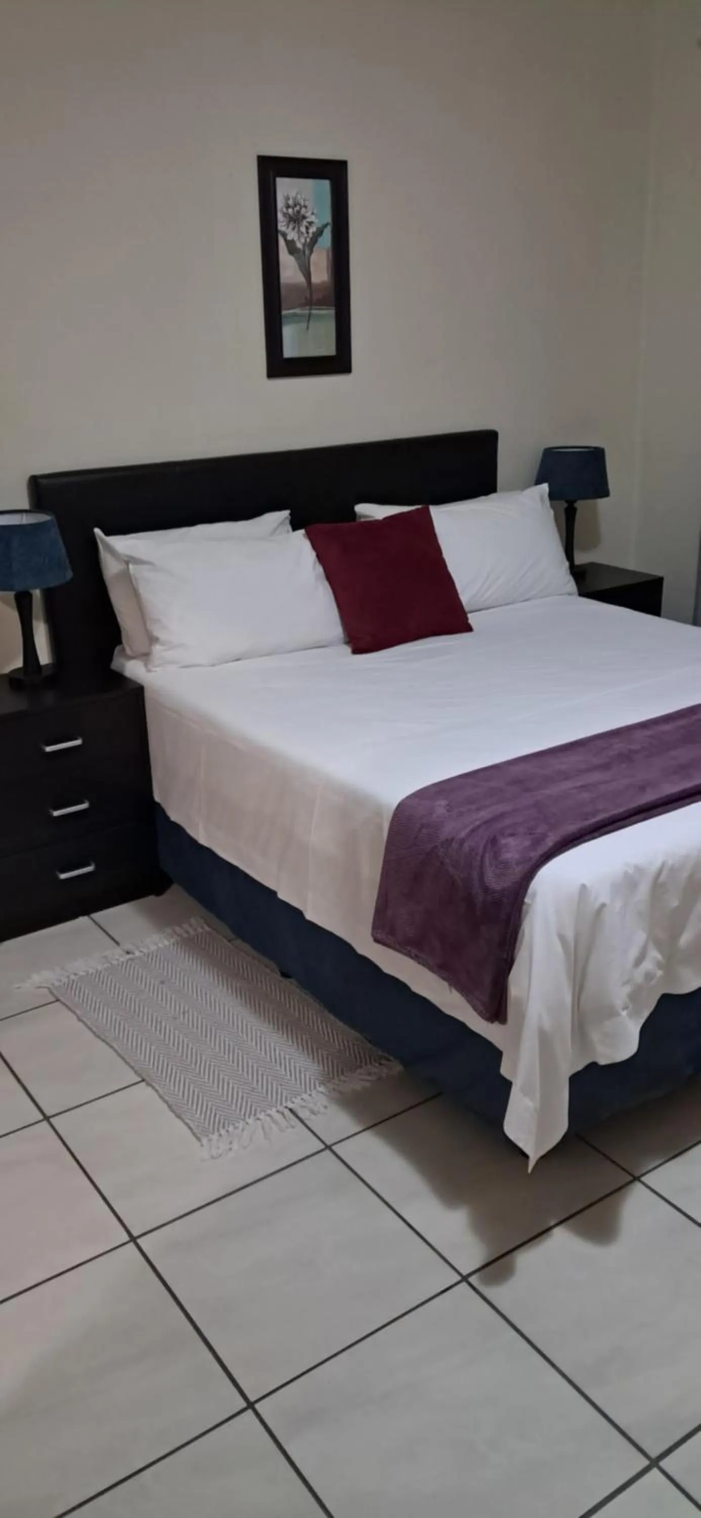 Bed in Sand River Cottages