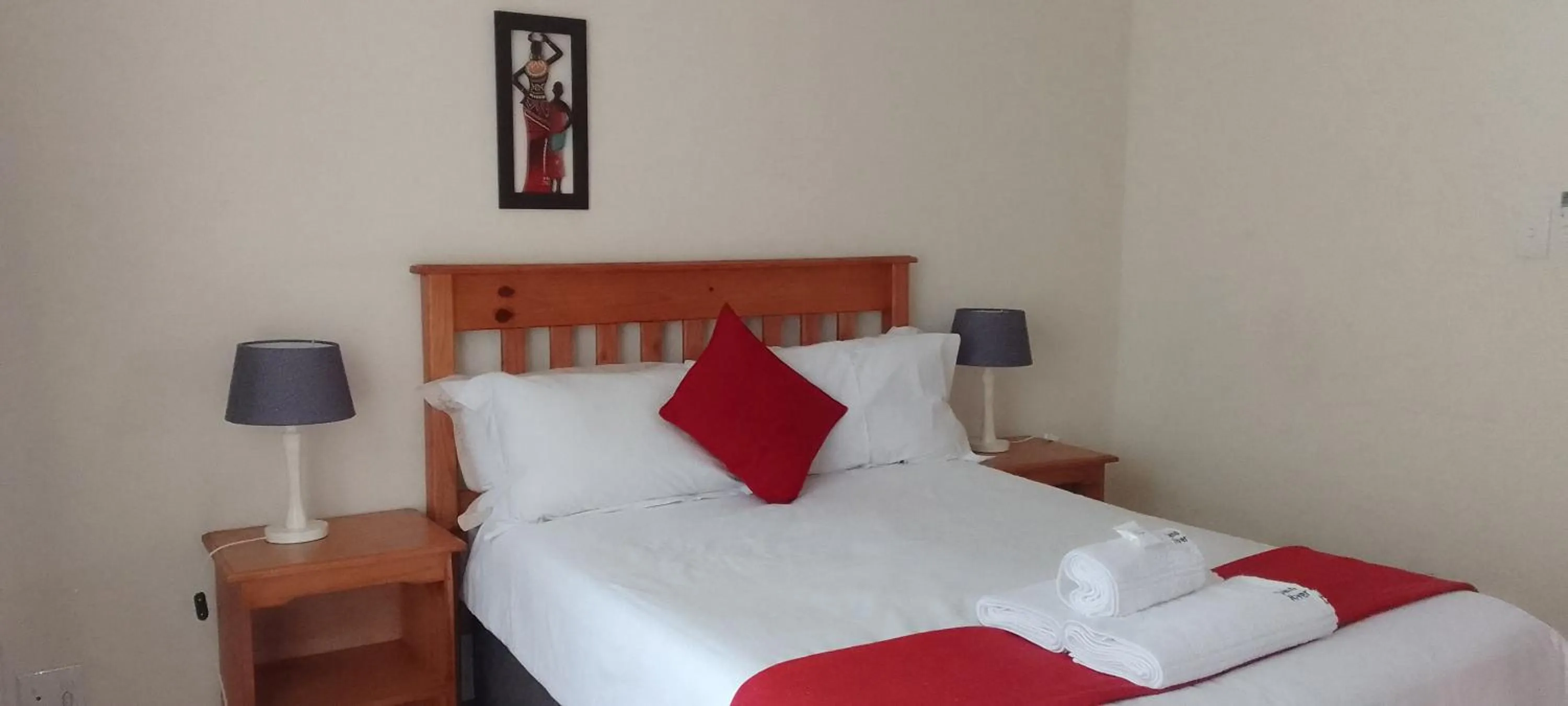 Bed in Sand River Cottages