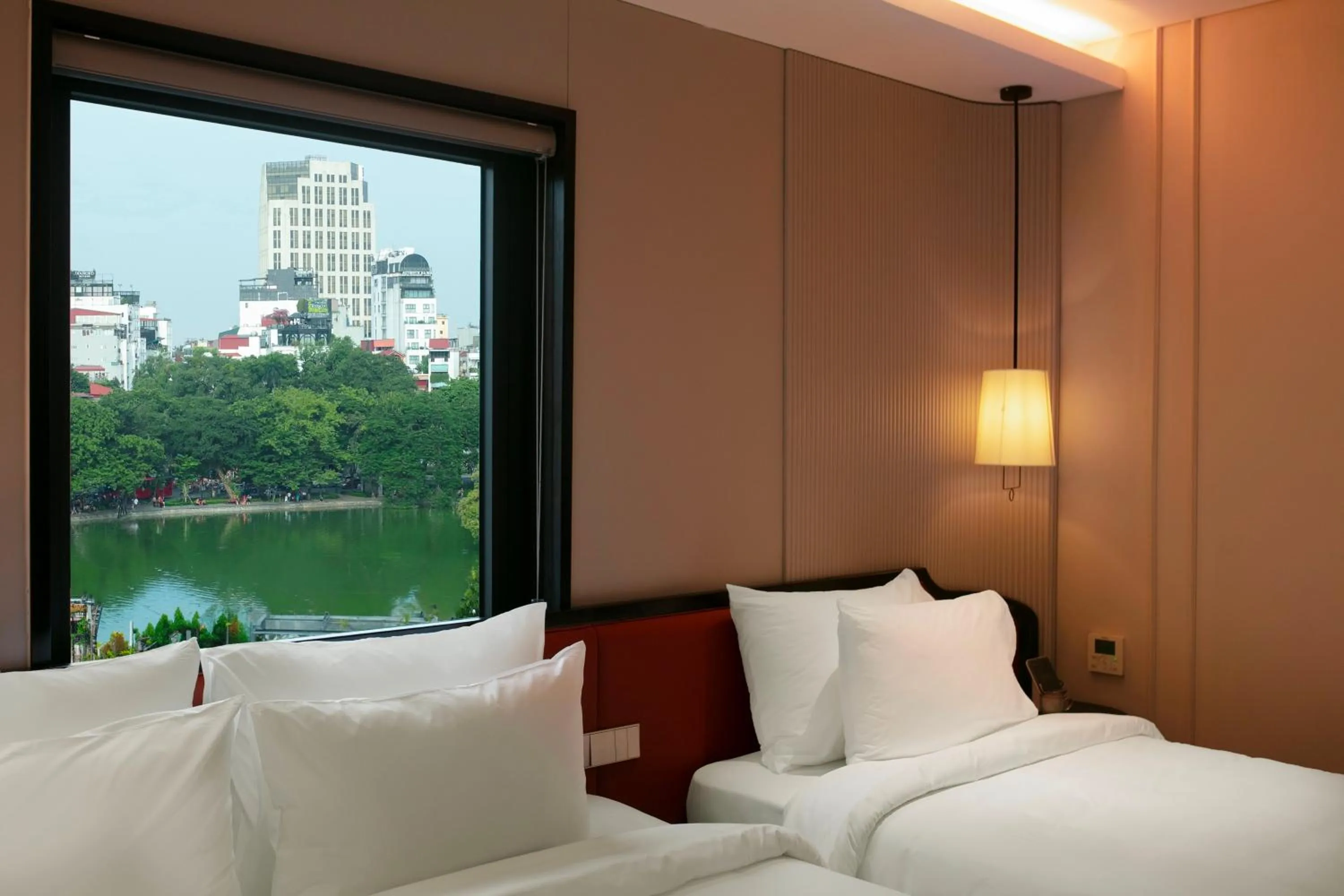 Bed in Le Premier Hotel & Rooftop Bar