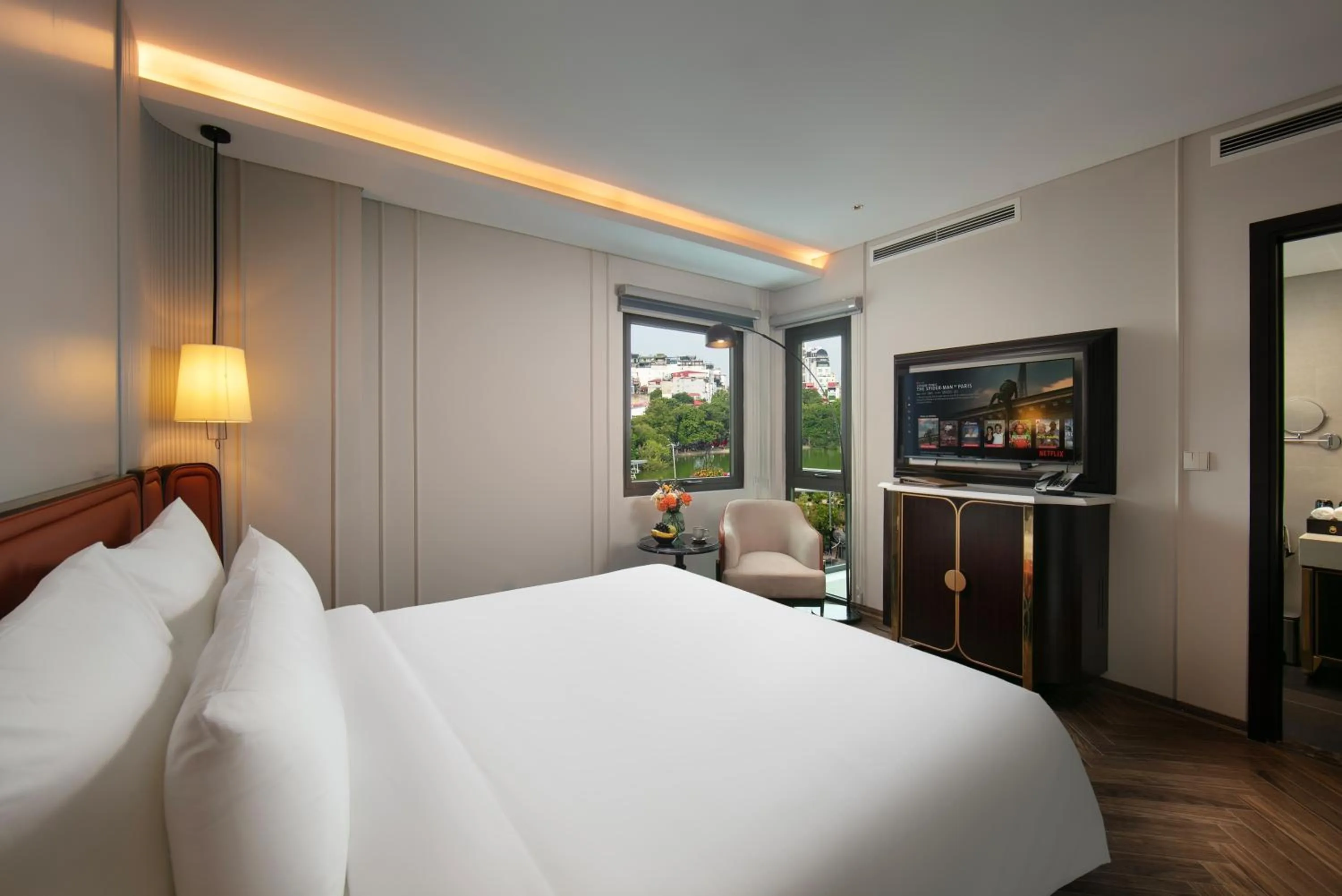 Bed in Le Premier Hotel & Rooftop Bar