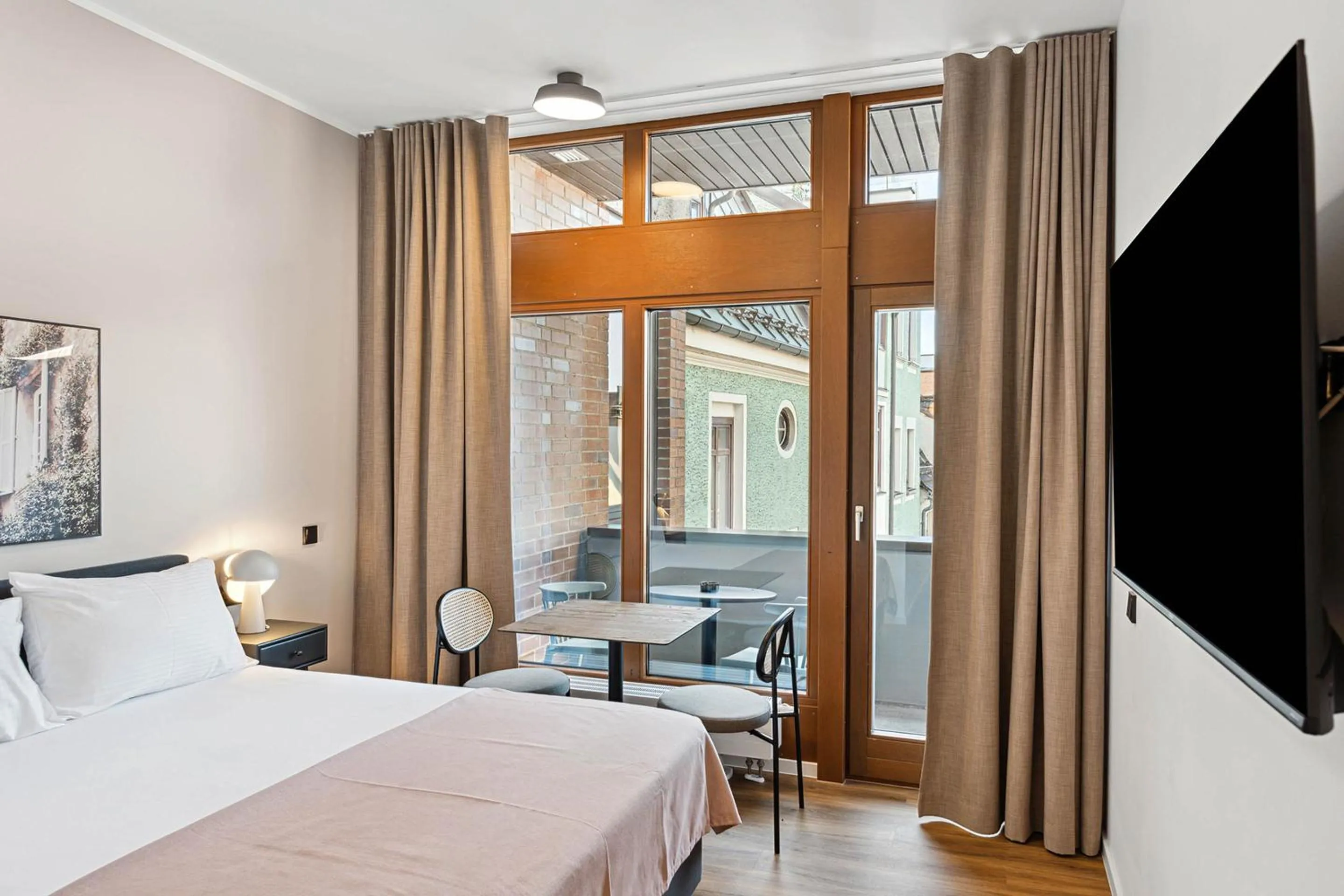 Bed in Limehome Memmingen Maximilianstraße