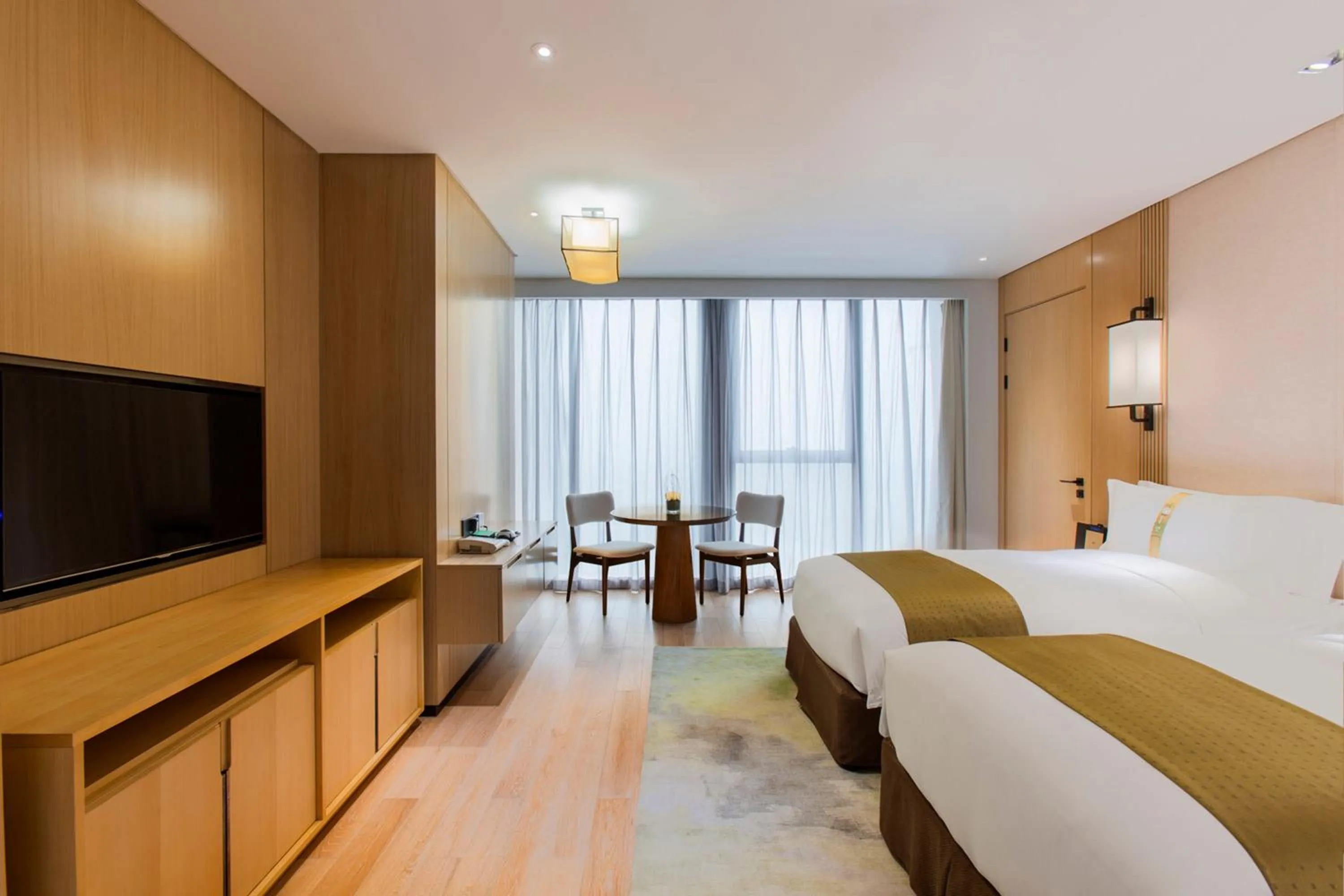 Photo of the whole room, Bed in Holiday Inn Nanjing Qinhuai South Suites by IHG