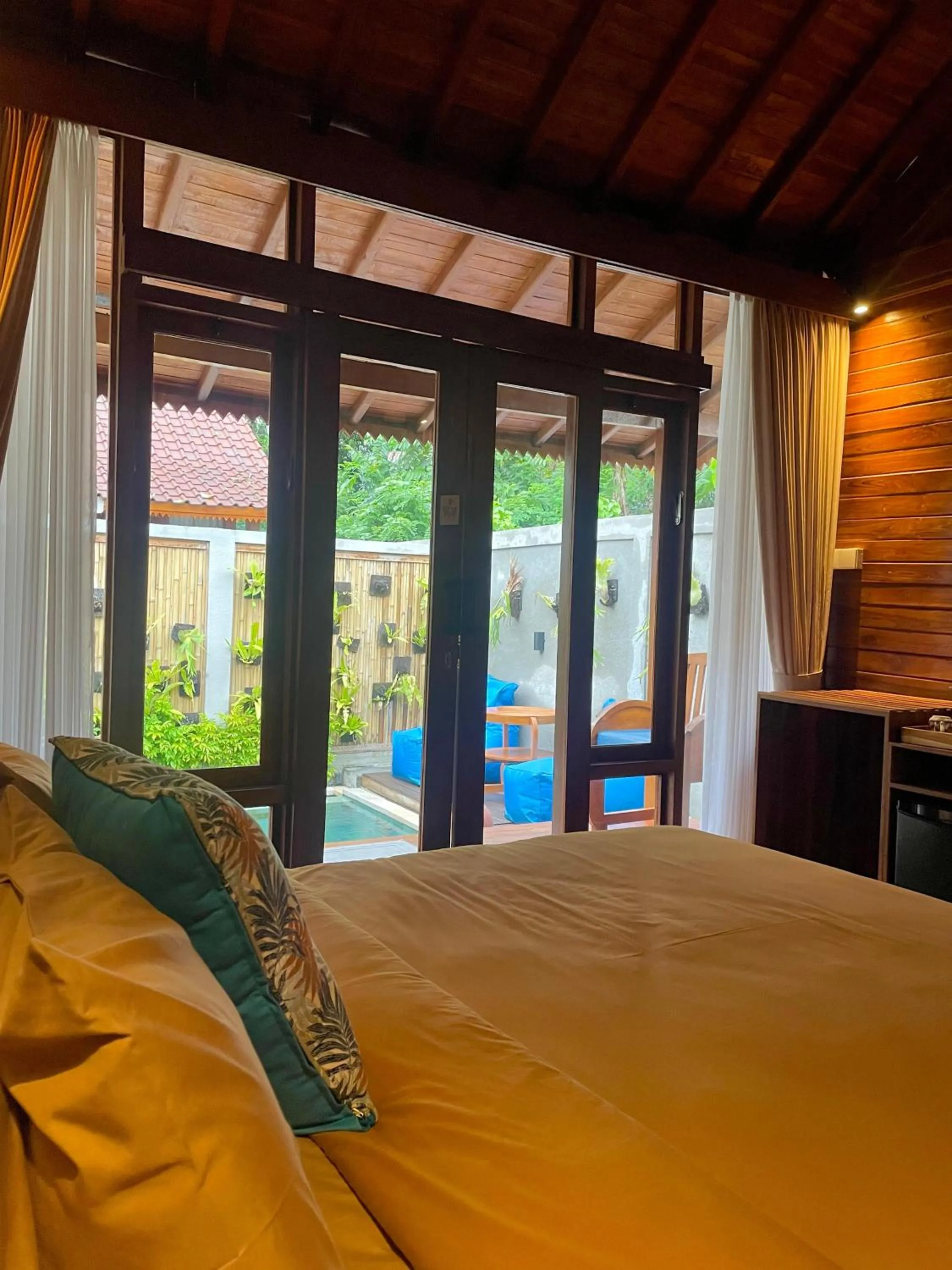 Bed in Ngesil Private Joglo & Pool