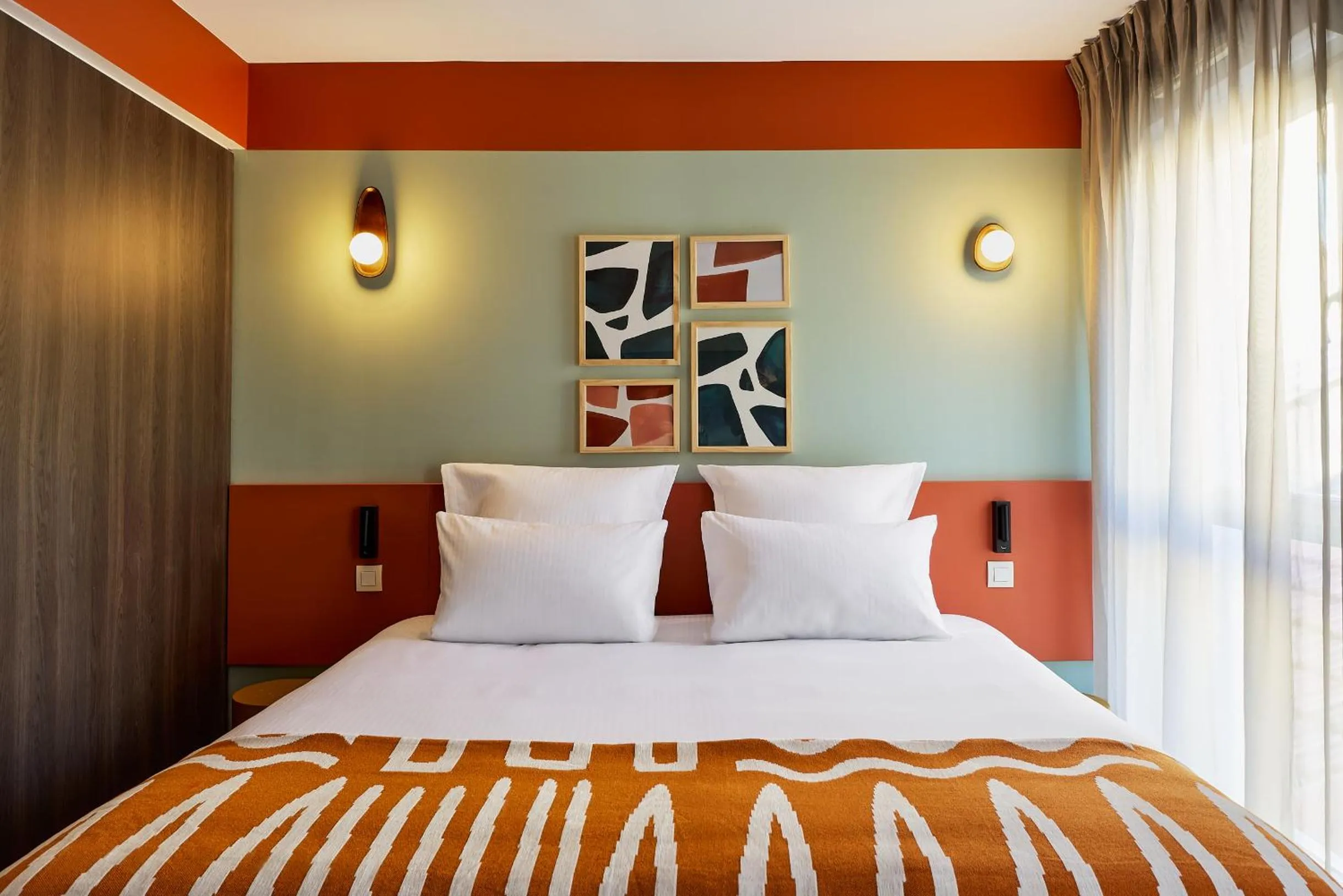 Bed in Hôtel Ligo by HappyCulture