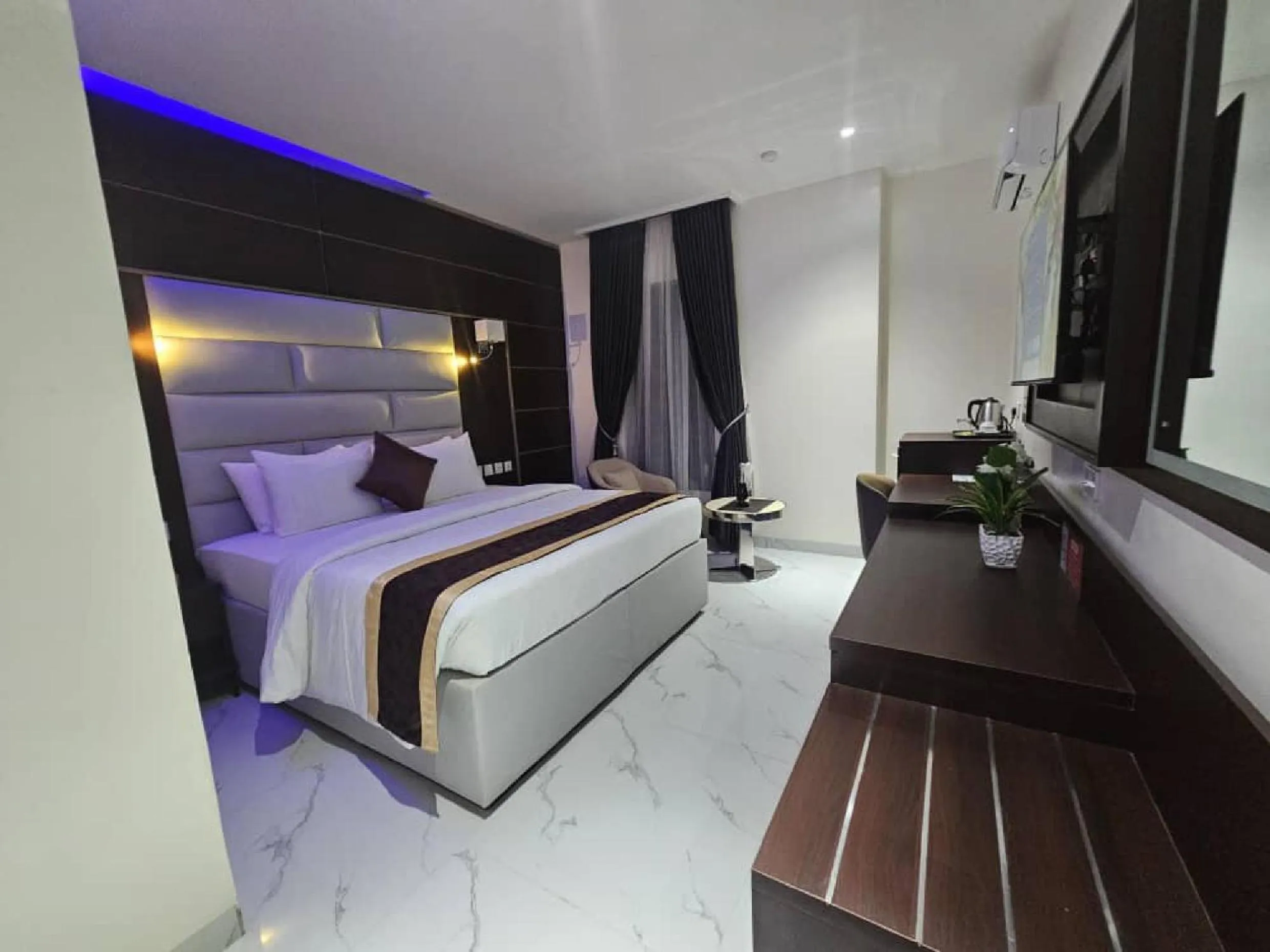 Bed in Carlton Swiss Luxury Residency