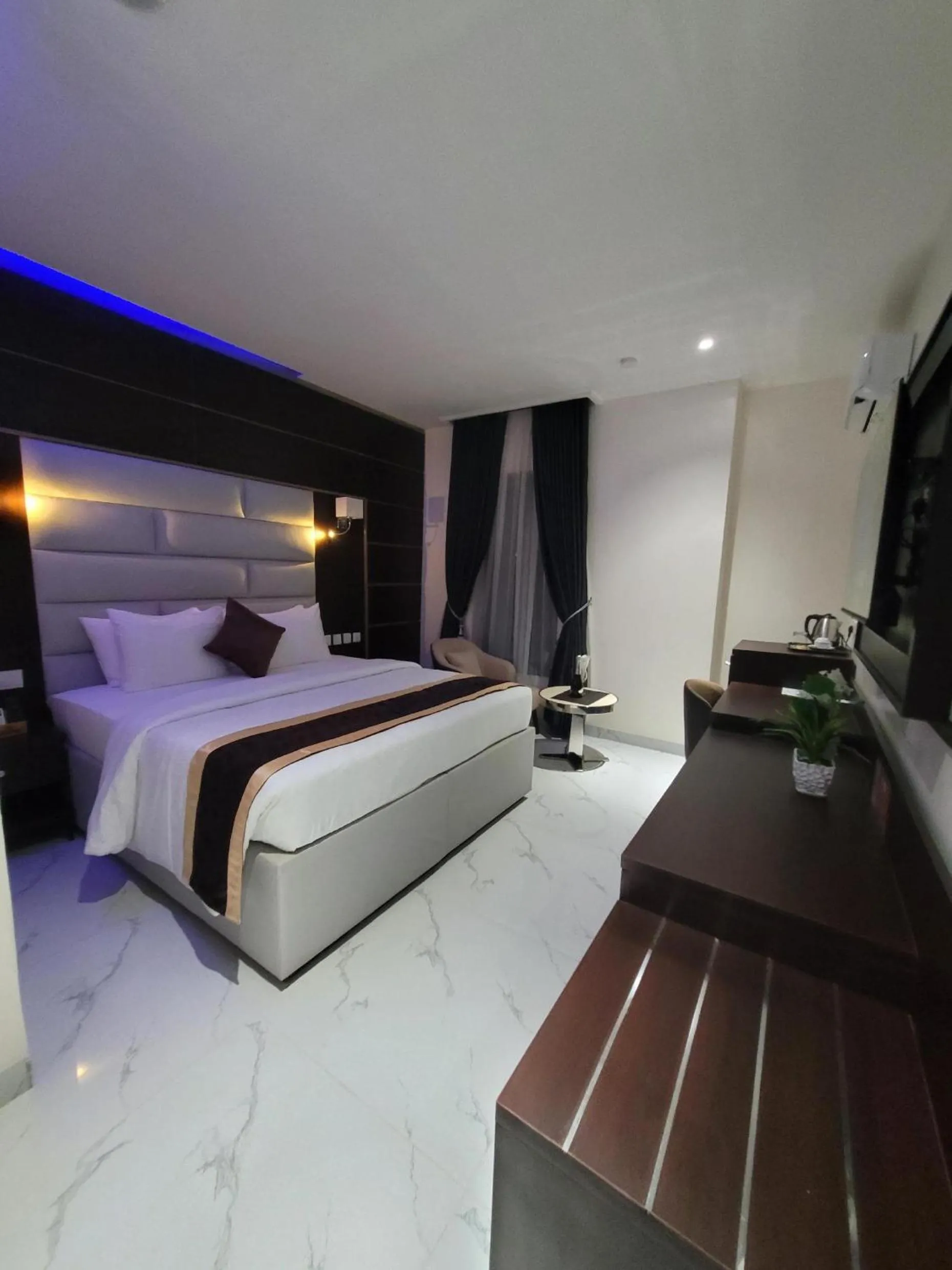 Bed in Carlton Swiss Luxury Residency