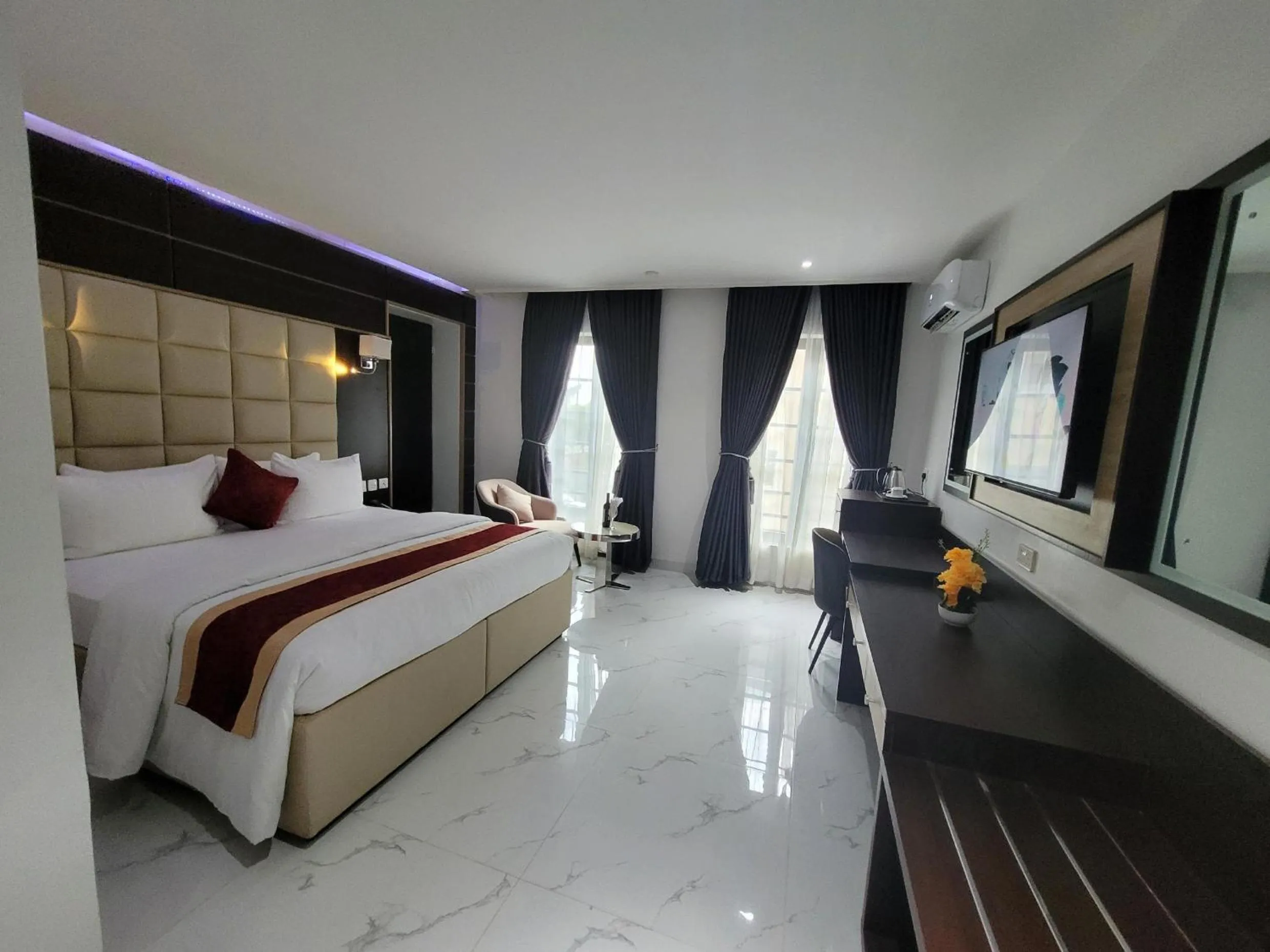 Bed in Carlton Swiss Luxury Residency