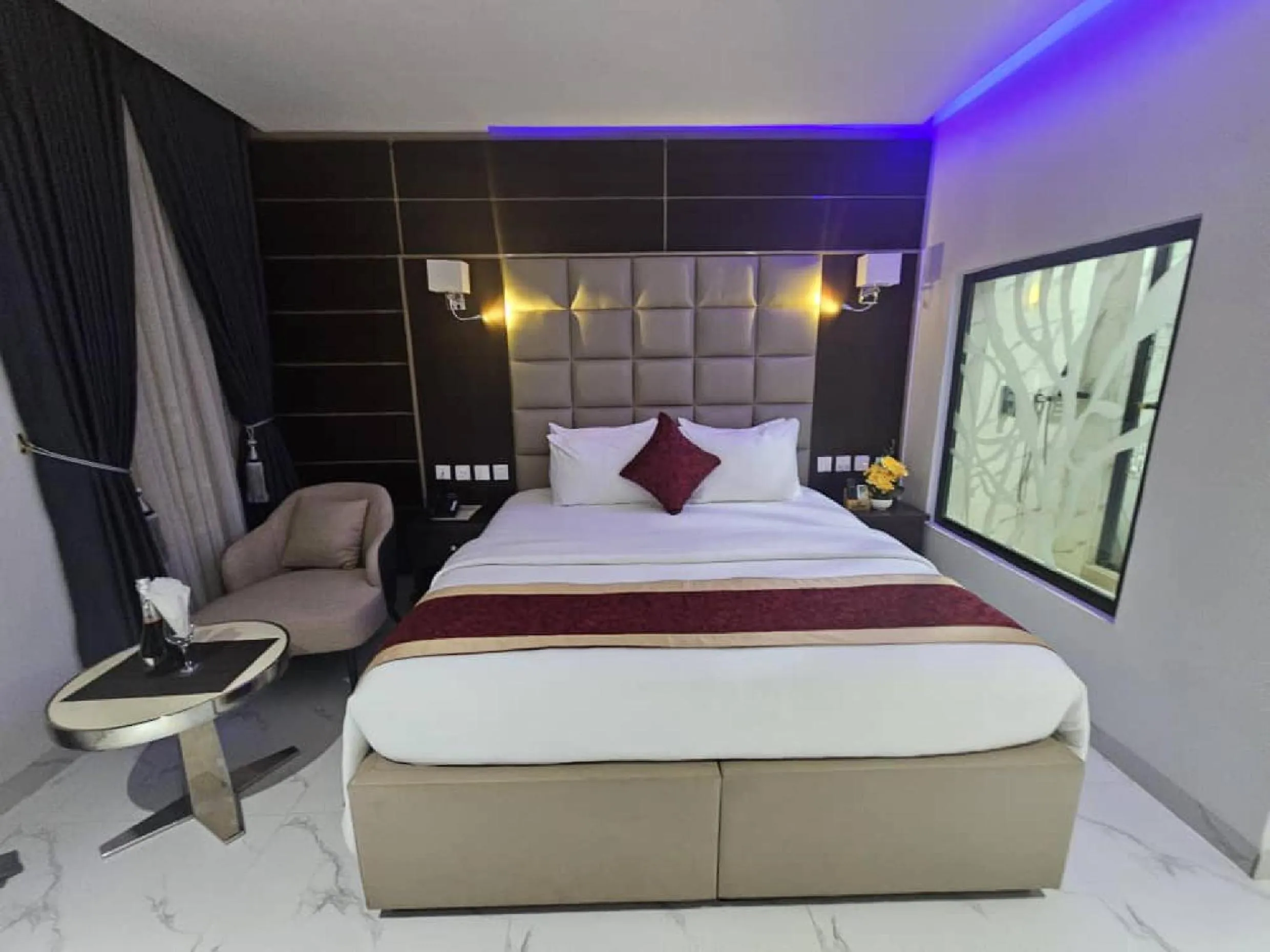 Bed in Carlton Swiss Luxury Residency