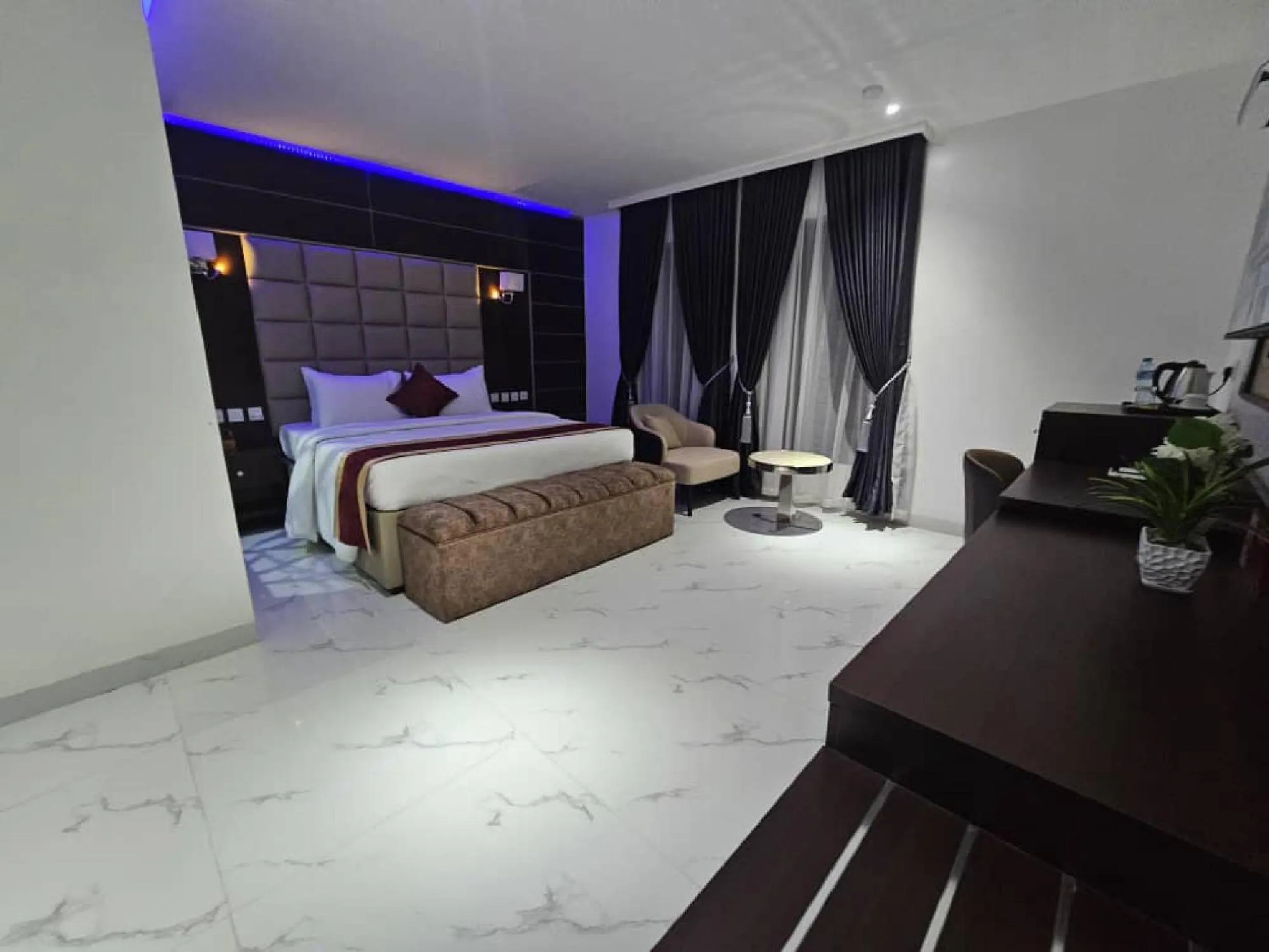 Bed in Carlton Swiss Luxury Residency