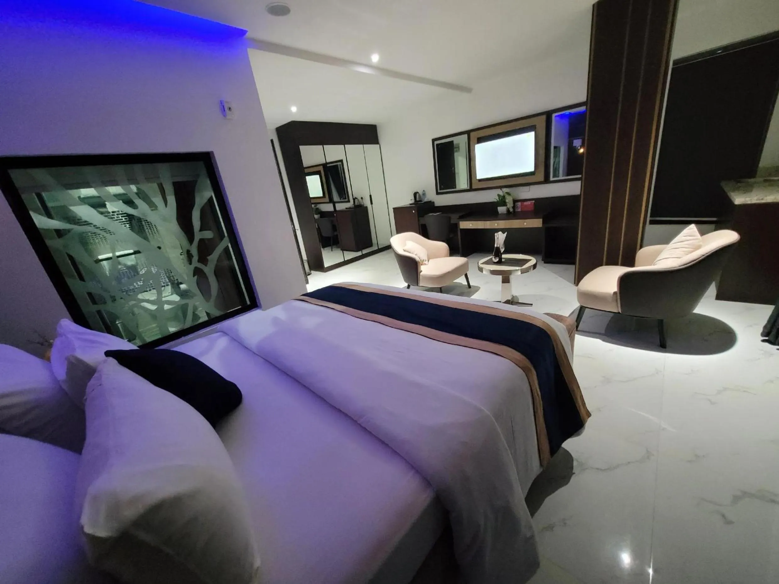 Bed in Carlton Swiss Luxury Residency