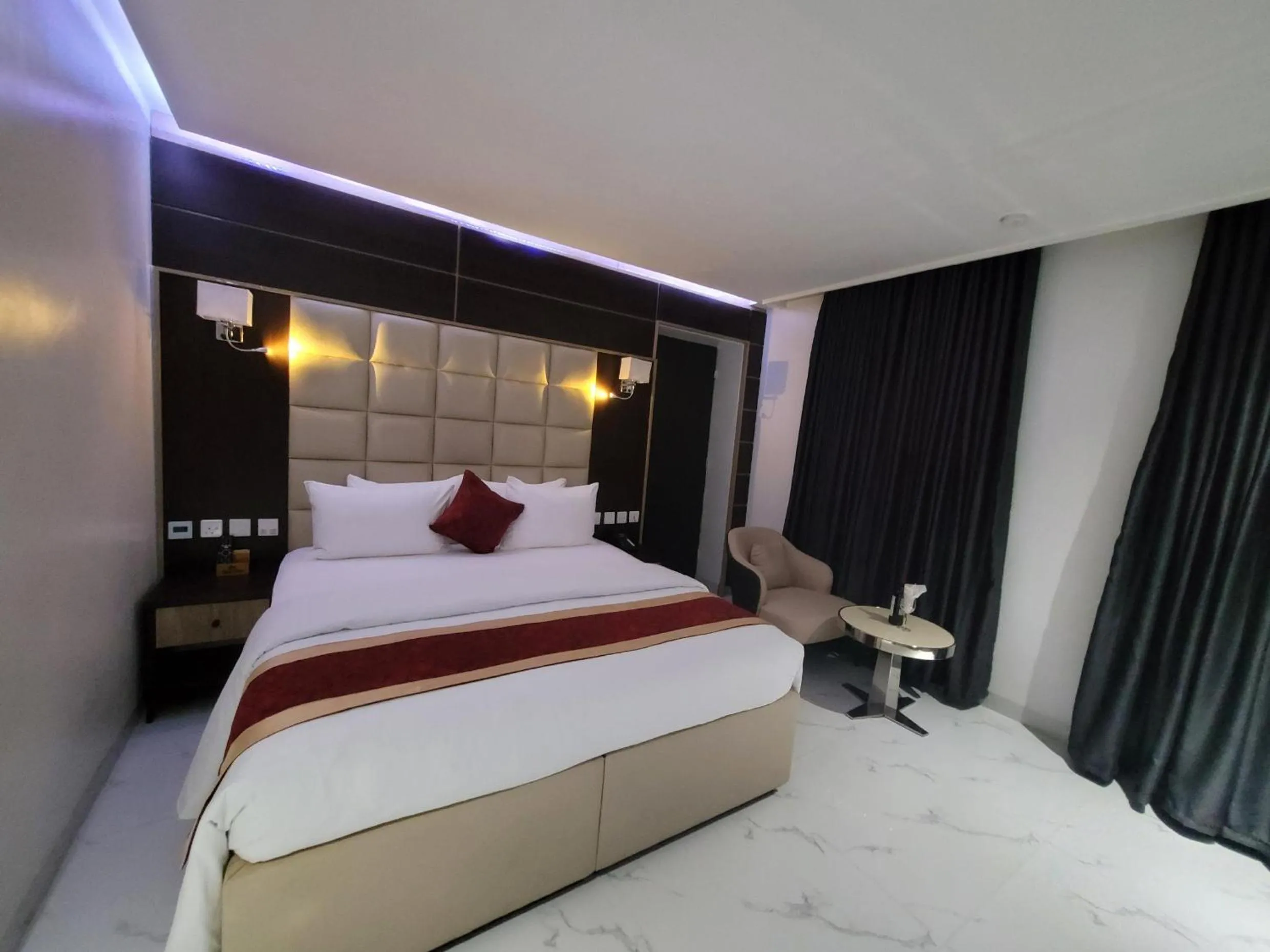 Bed in Carlton Swiss Luxury Residency