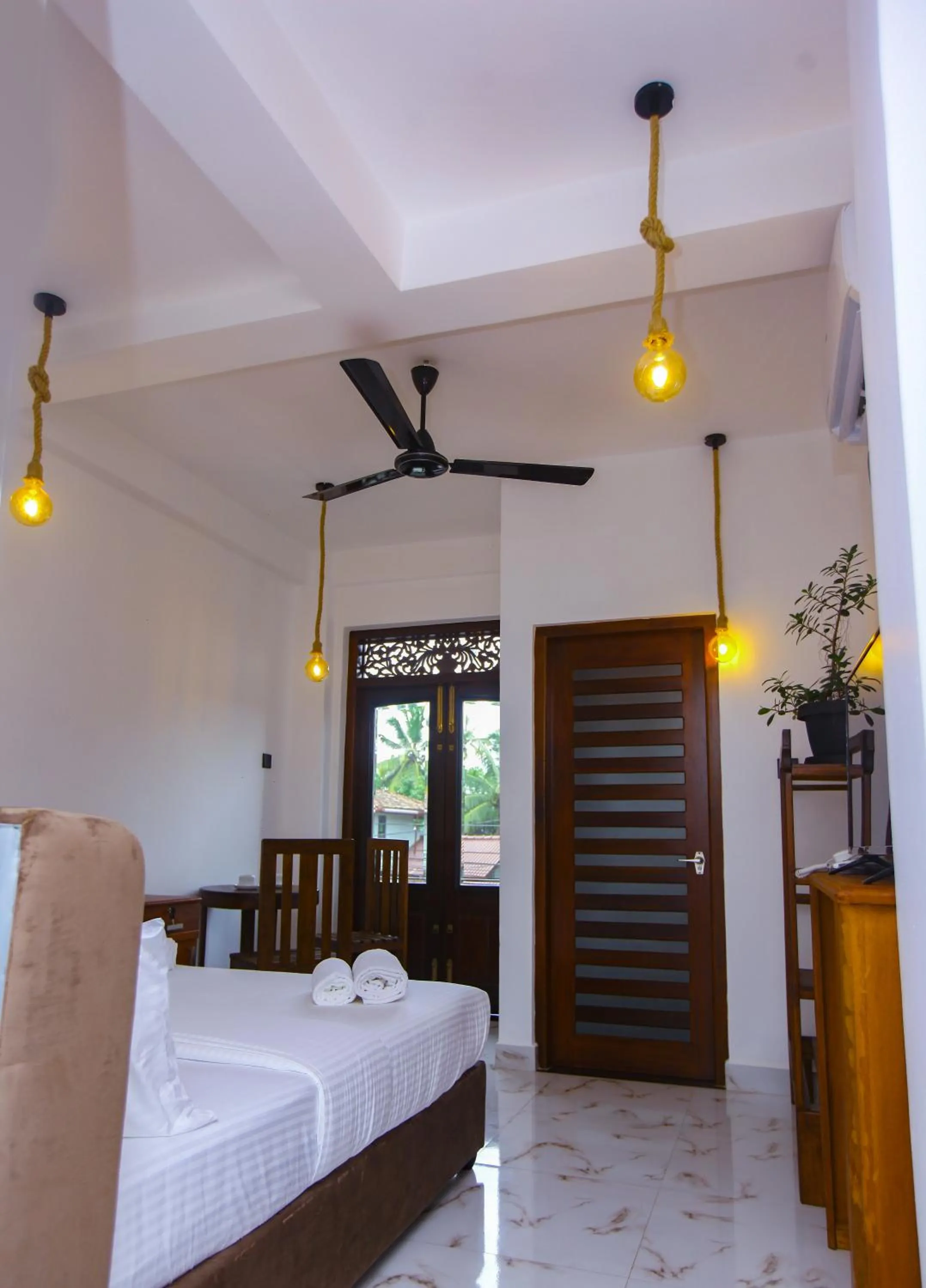 Photo of the whole room, Bed in Sakura Surf Lanka Hotel & Restaurant