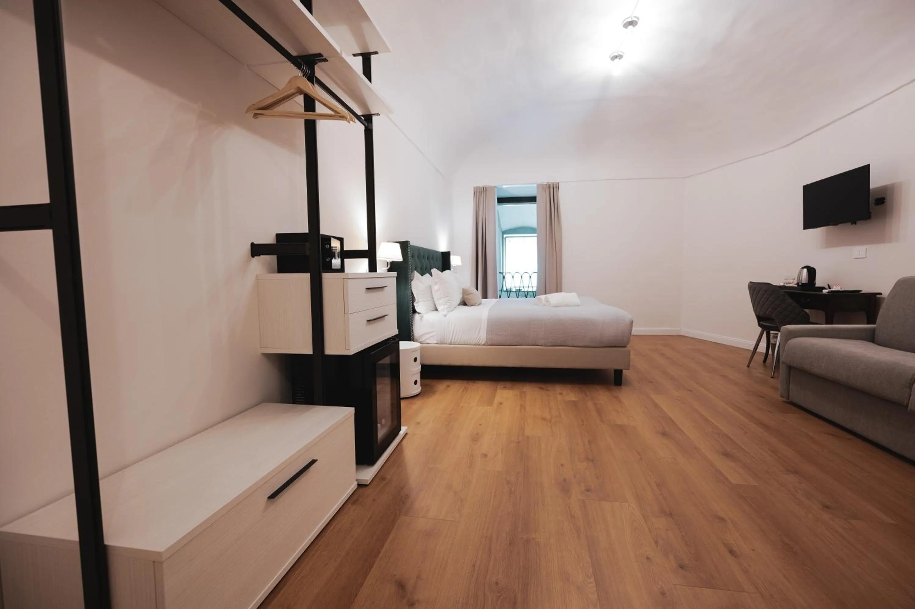 Photo of the whole room, Bed in Carlo Felice Boutique Hotel