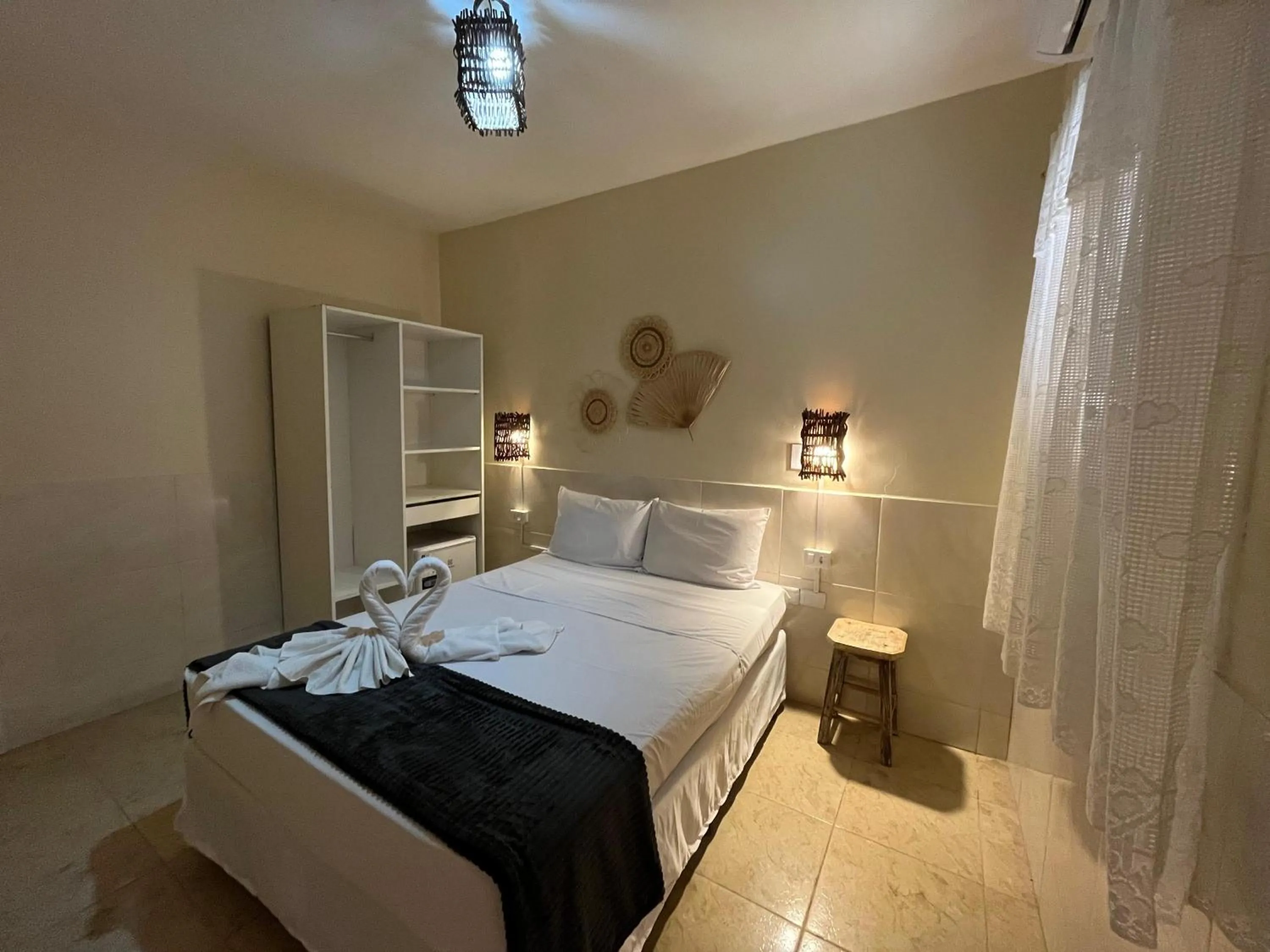 Bed in Pousada Flor de Merepe