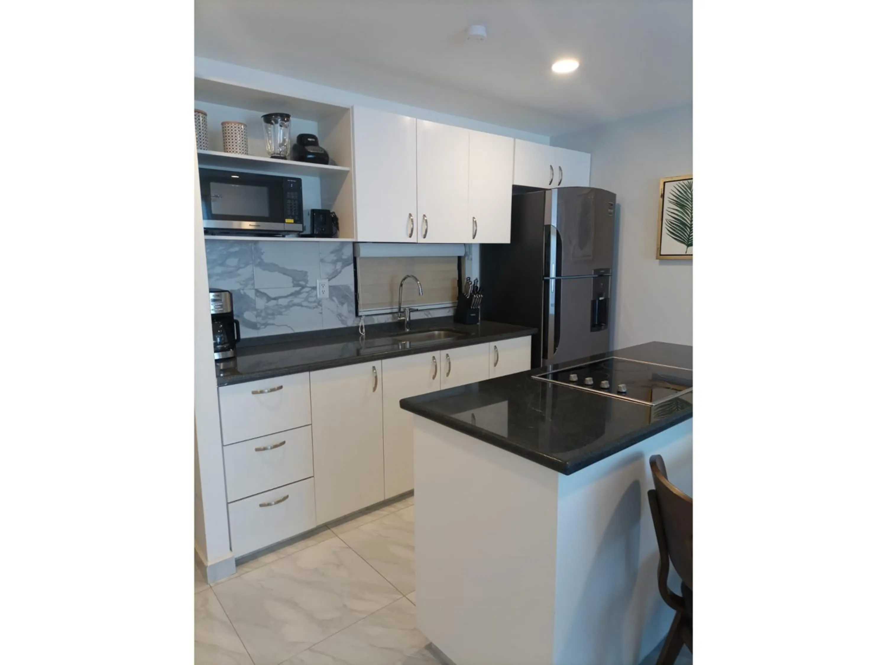 Kitchen or kitchenette in Collection O Morgan City Center, Los Cabos