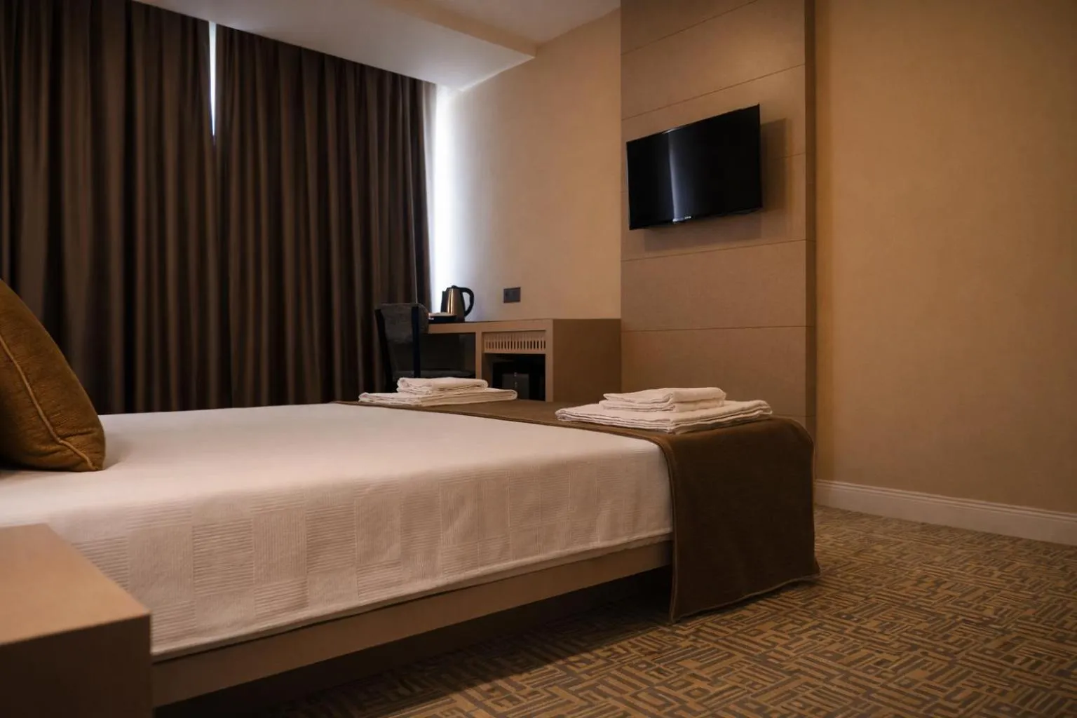 Bed in Bonnie City Hotel