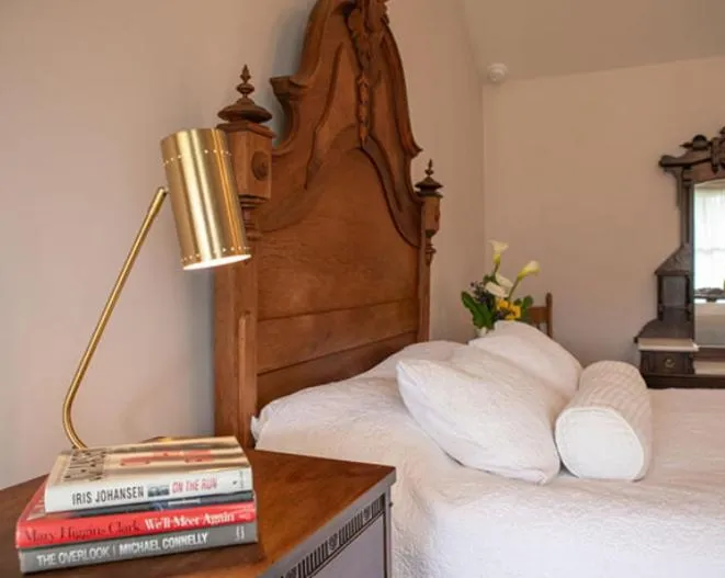 Bed in Dennen's Victorian Farmhouse