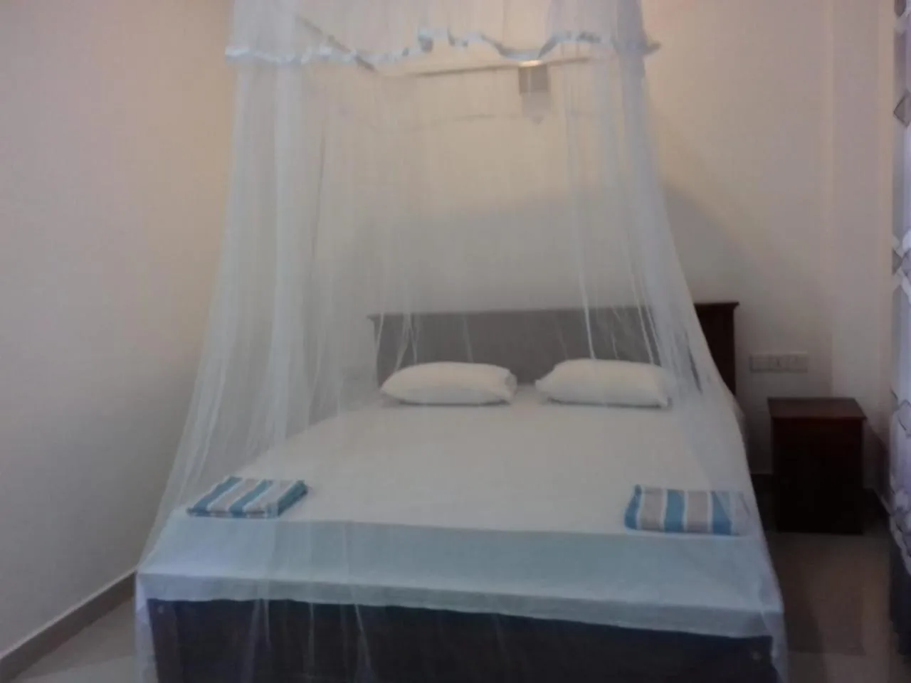 Bed in Hiru Resort Inn