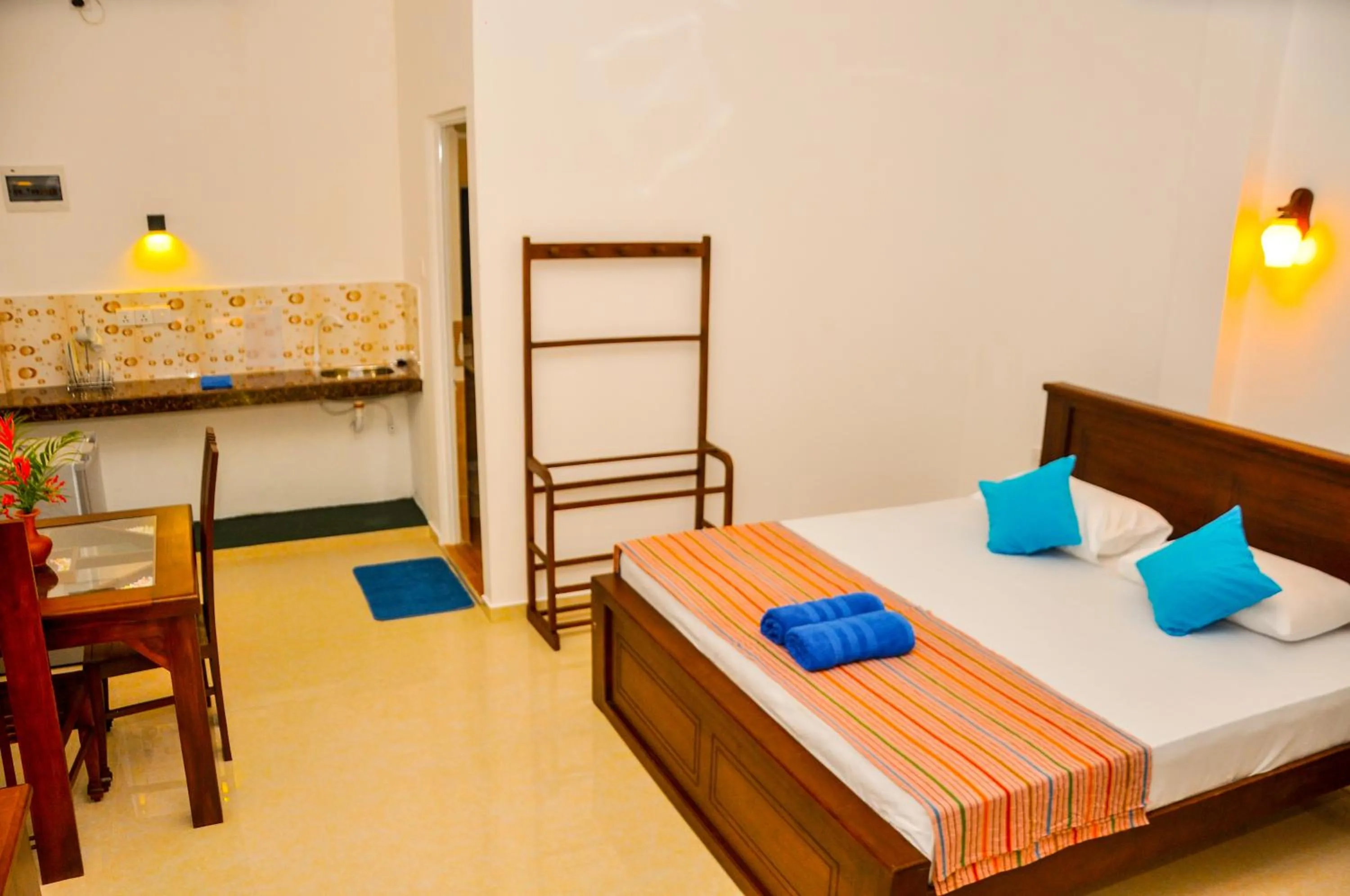 Bed in Hiru Resort Inn