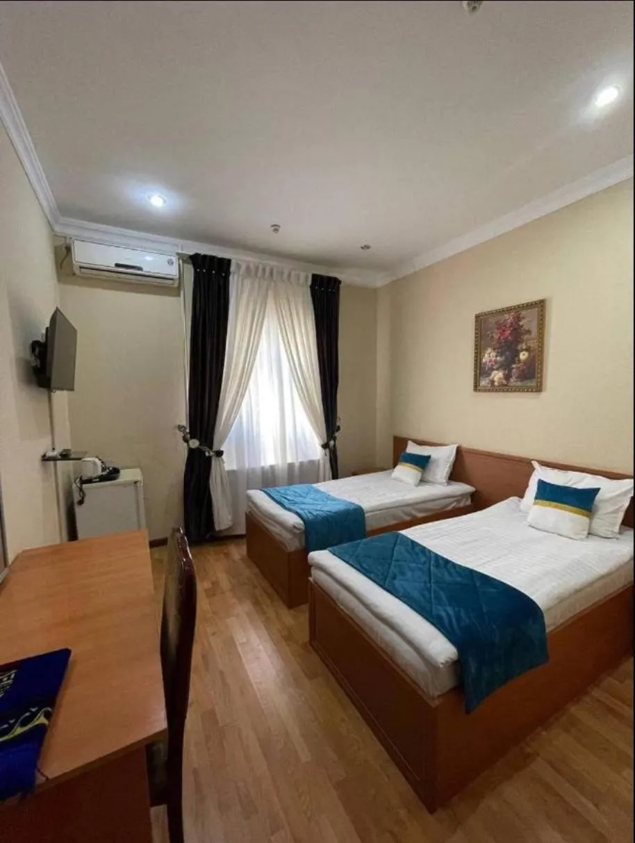 Bed in Marvarid Hotel