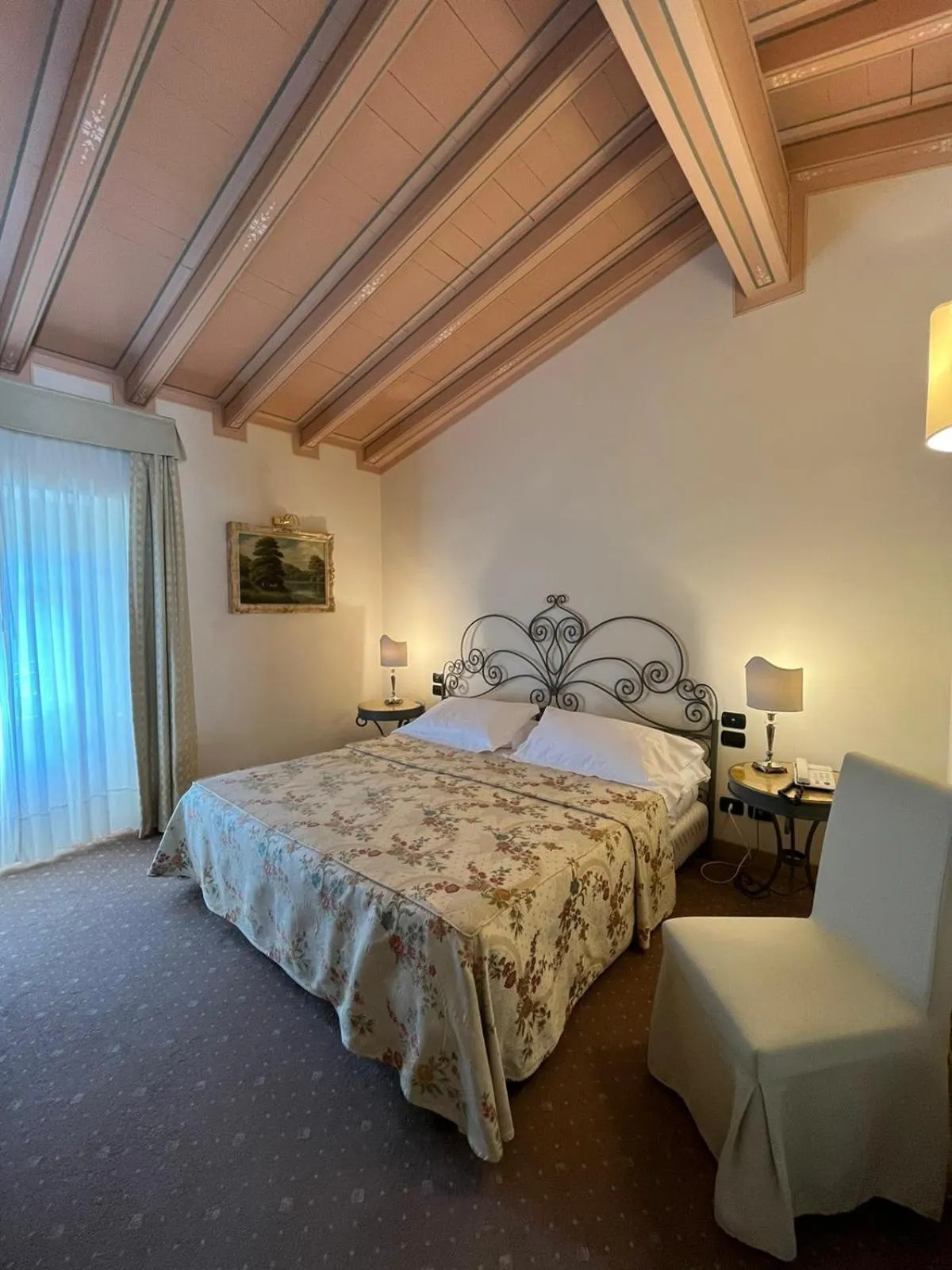 Photo of the whole room, Bed in Romantik Hotel Relais Mirabella Iseo