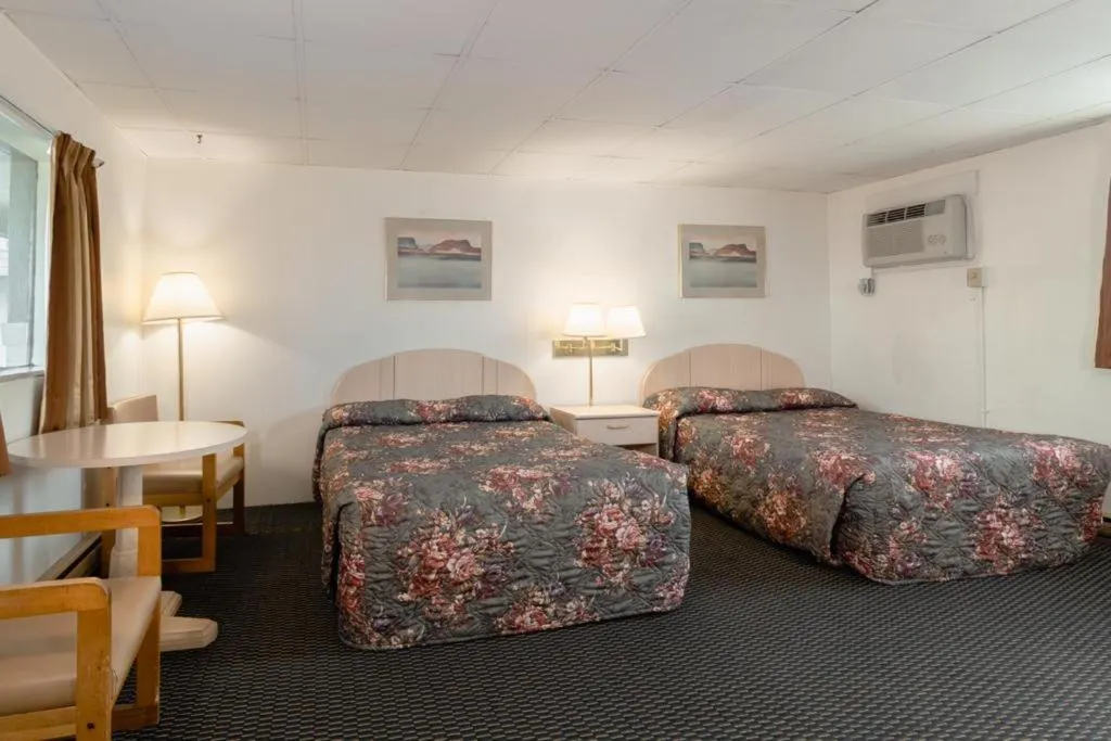 Bed in DuBois Manor Motel