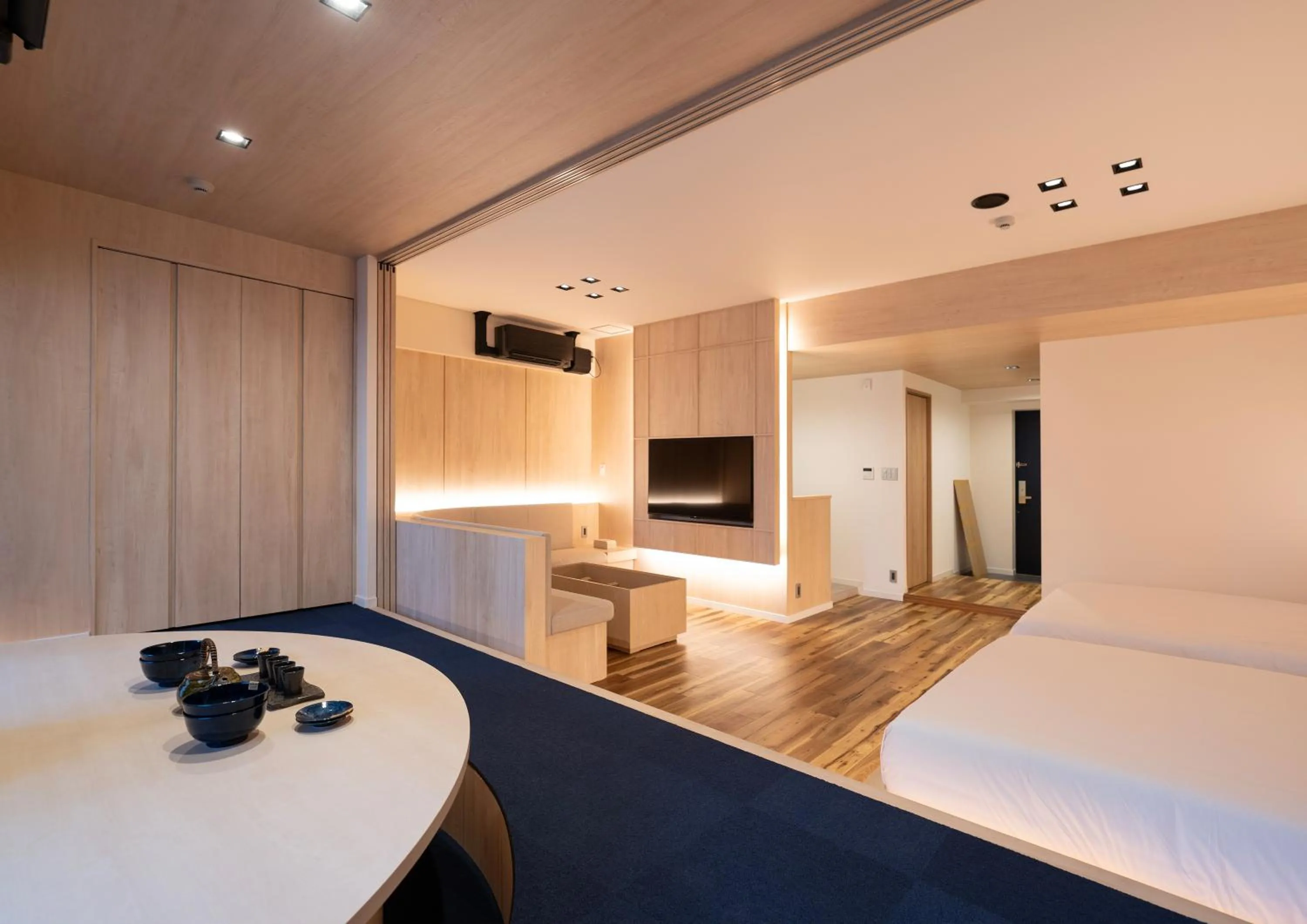 Living room, Bed in UH Suite Namba Station