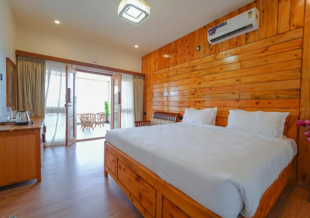 Bed in Silent Retreat Ooty Pool Resort by VOYE HOMES