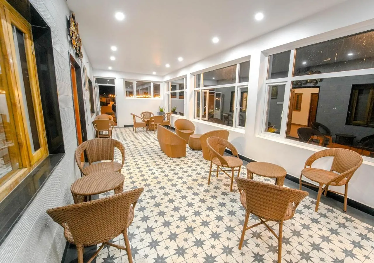 Living room in Silent Retreat Ooty Pool Resort by VOYE HOMES