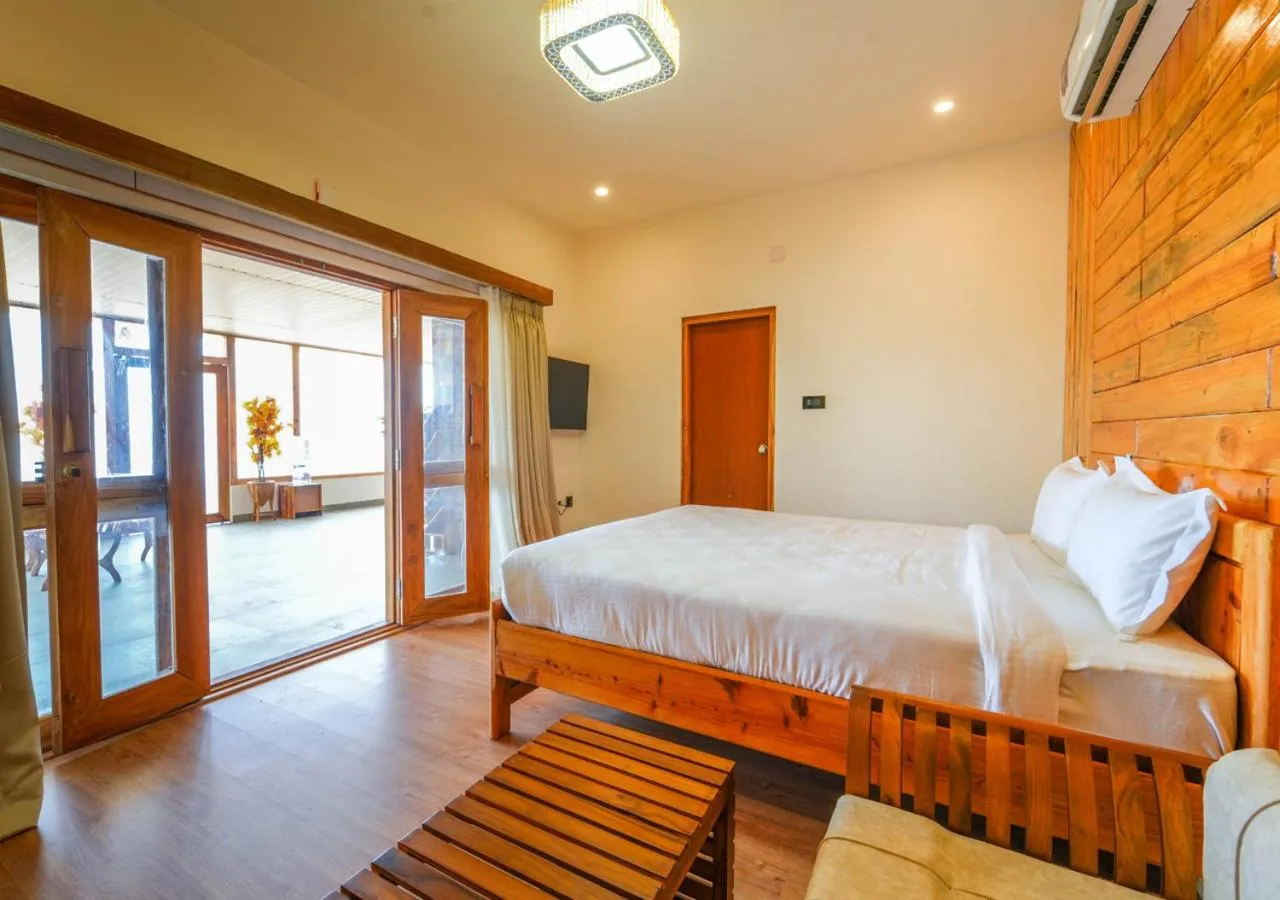 Bed in Silent Retreat Ooty Pool Resort by VOYE HOMES