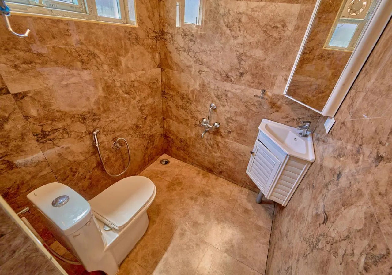 Bathroom in Silent Retreat Ooty Pool Resort by VOYE HOMES