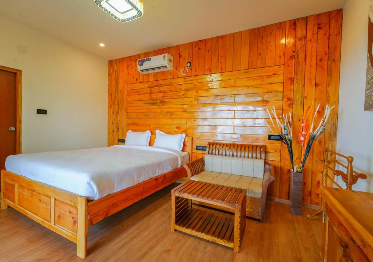 Bed in Silent Retreat Ooty Pool Resort by VOYE HOMES