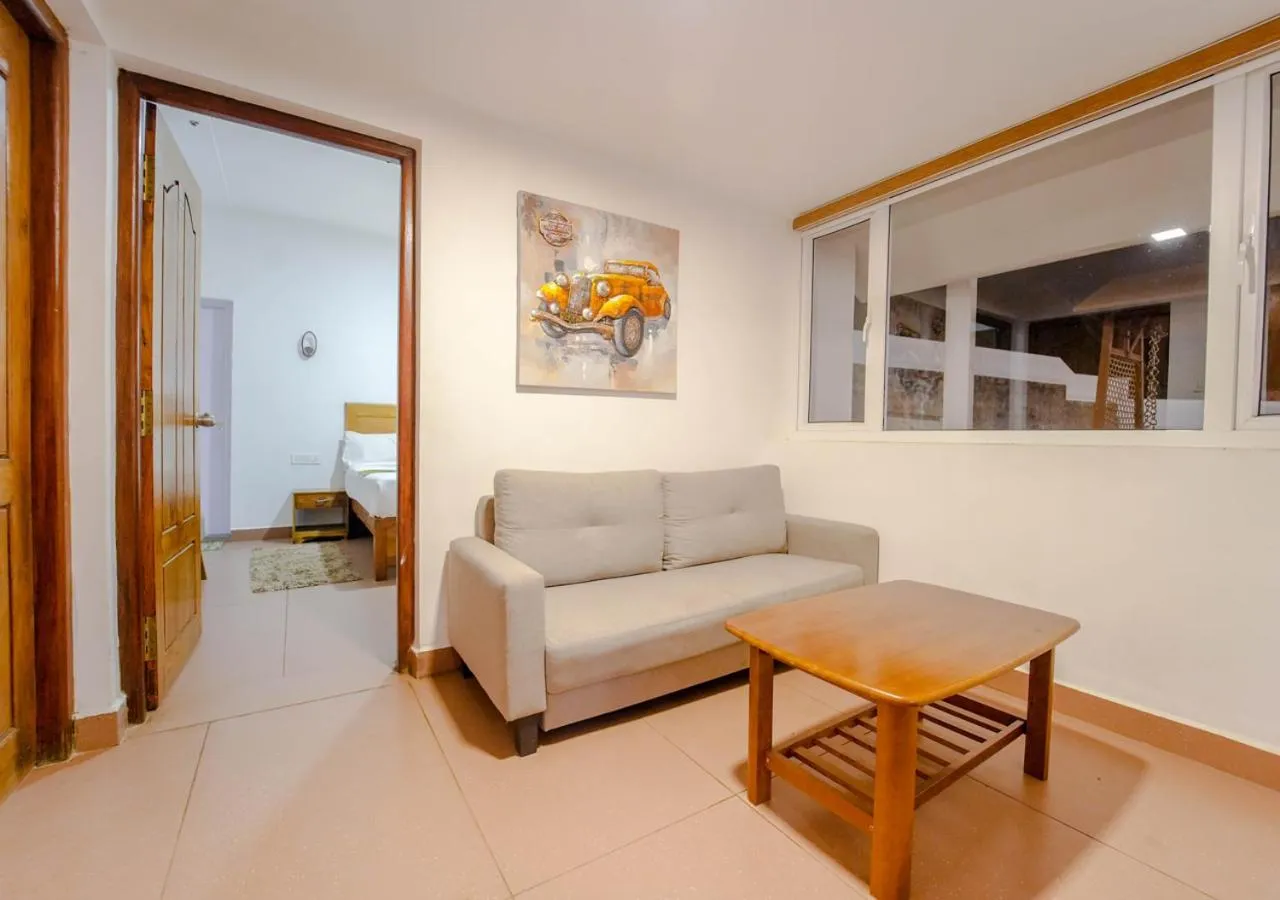 Living room in Silent Retreat Ooty Pool Resort by VOYE HOMES