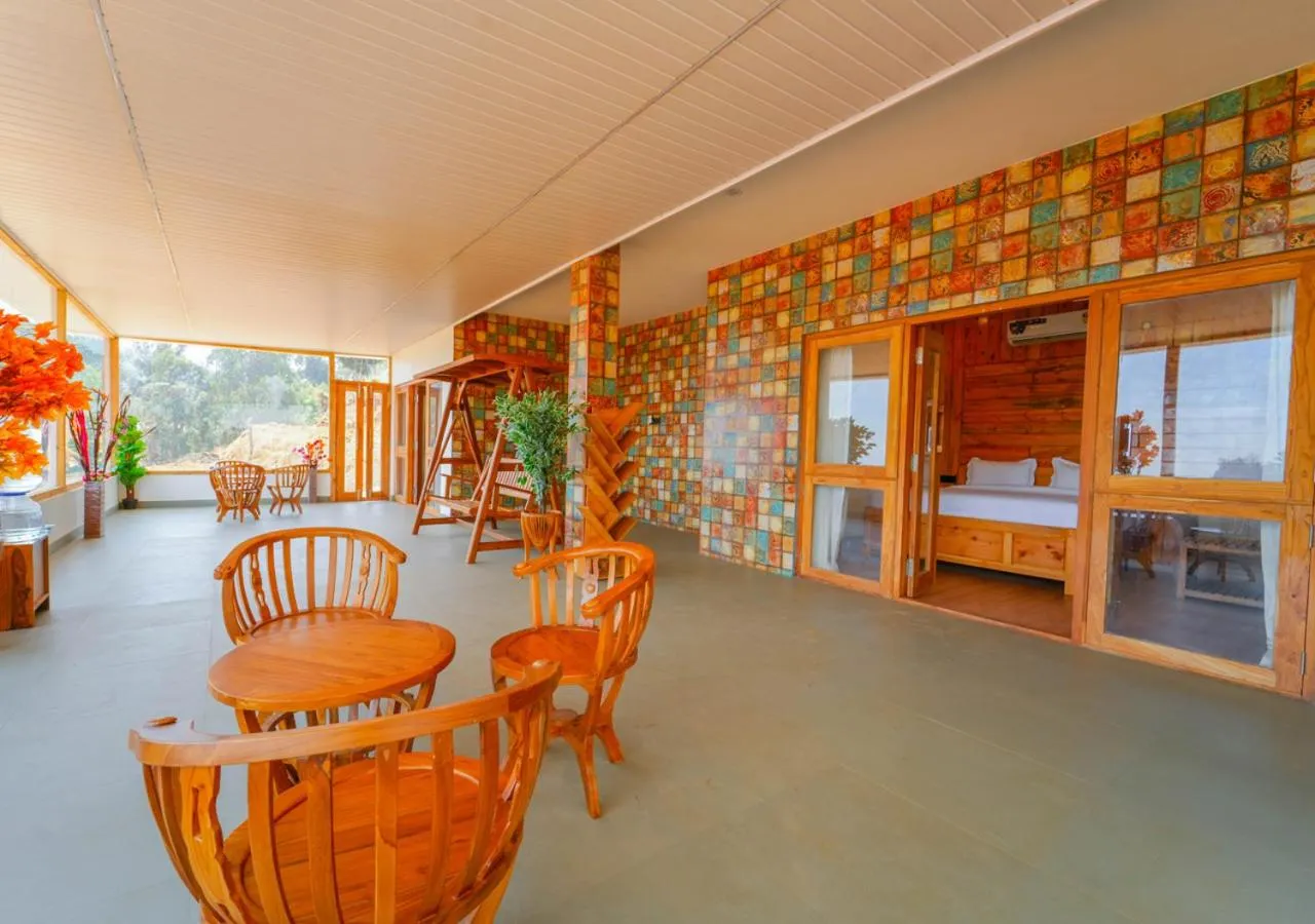 Living room in Silent Retreat Ooty Pool Resort by VOYE HOMES