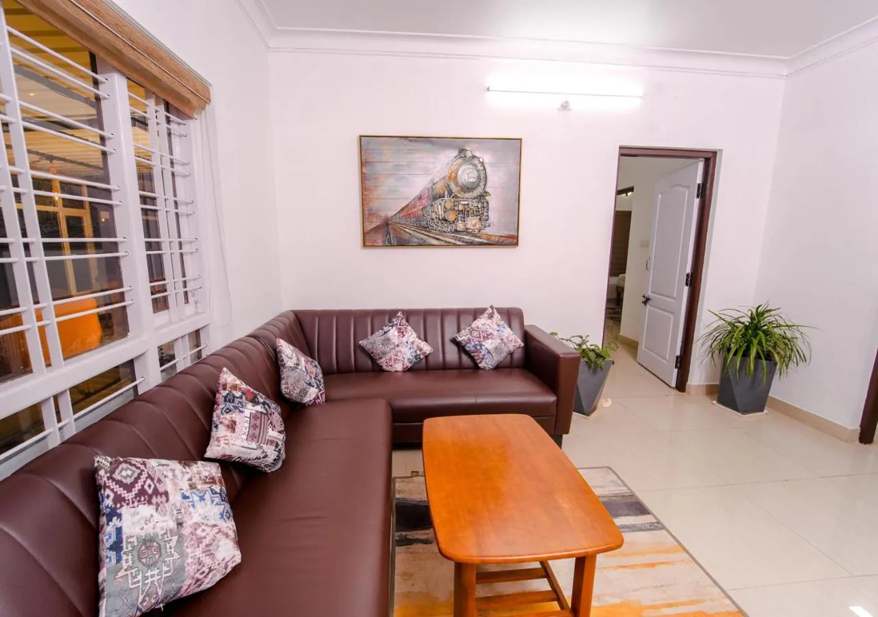 Living room in Silent Retreat Ooty Pool Resort by VOYE HOMES