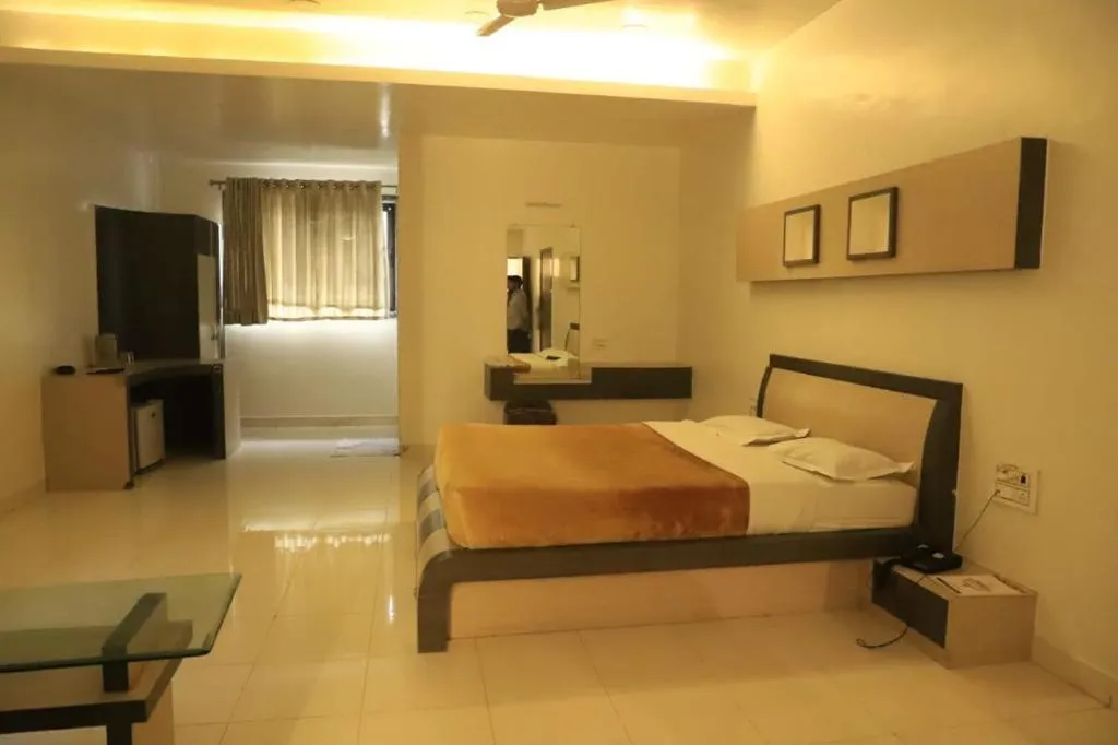 Photo of the whole room, Bed in The Byke Embassy - Surat