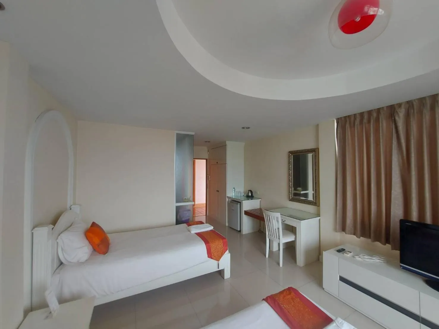 Bed in Grandsmile Wellness Resort