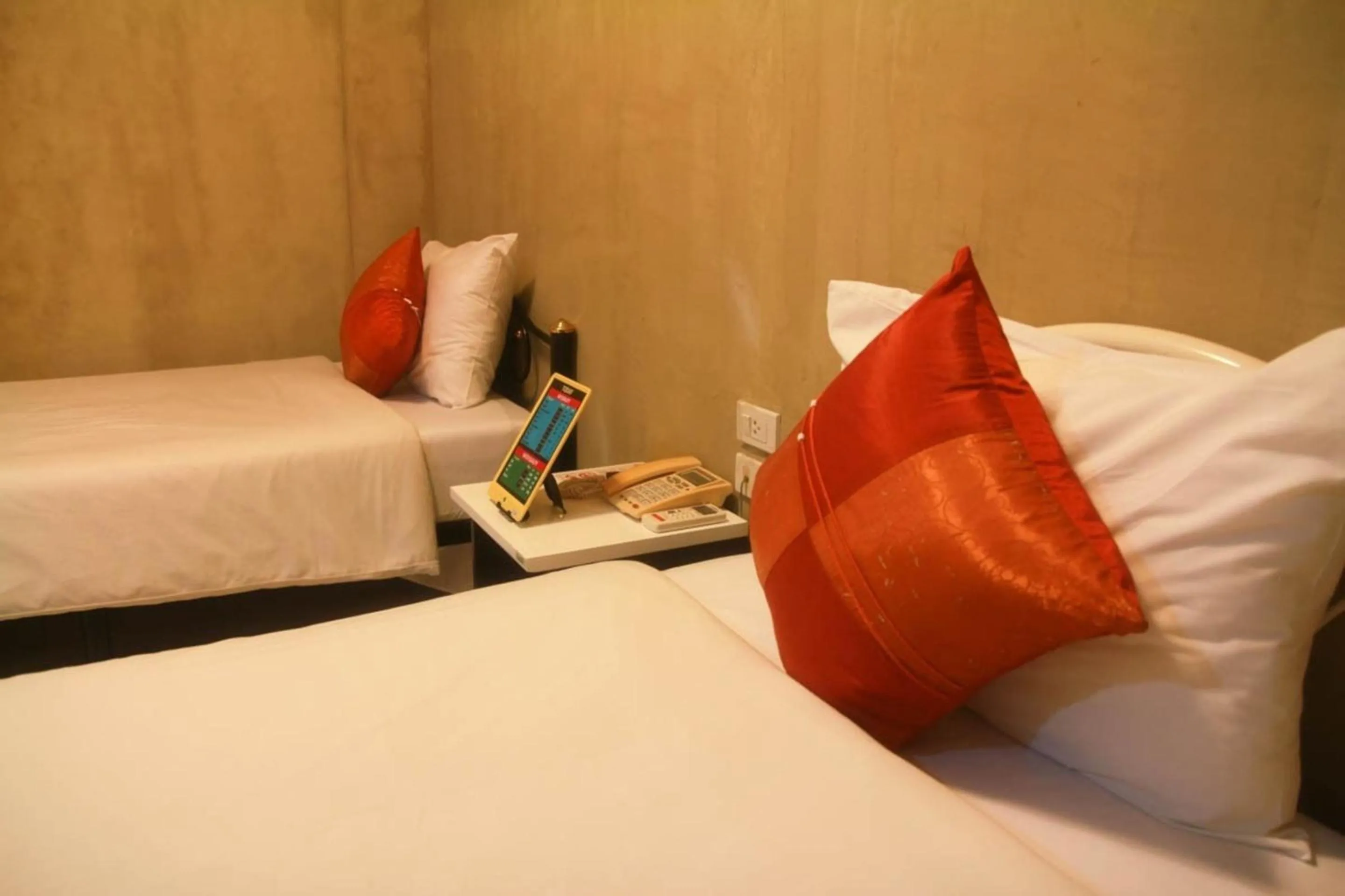 Bed in Grandsmile Wellness Resort