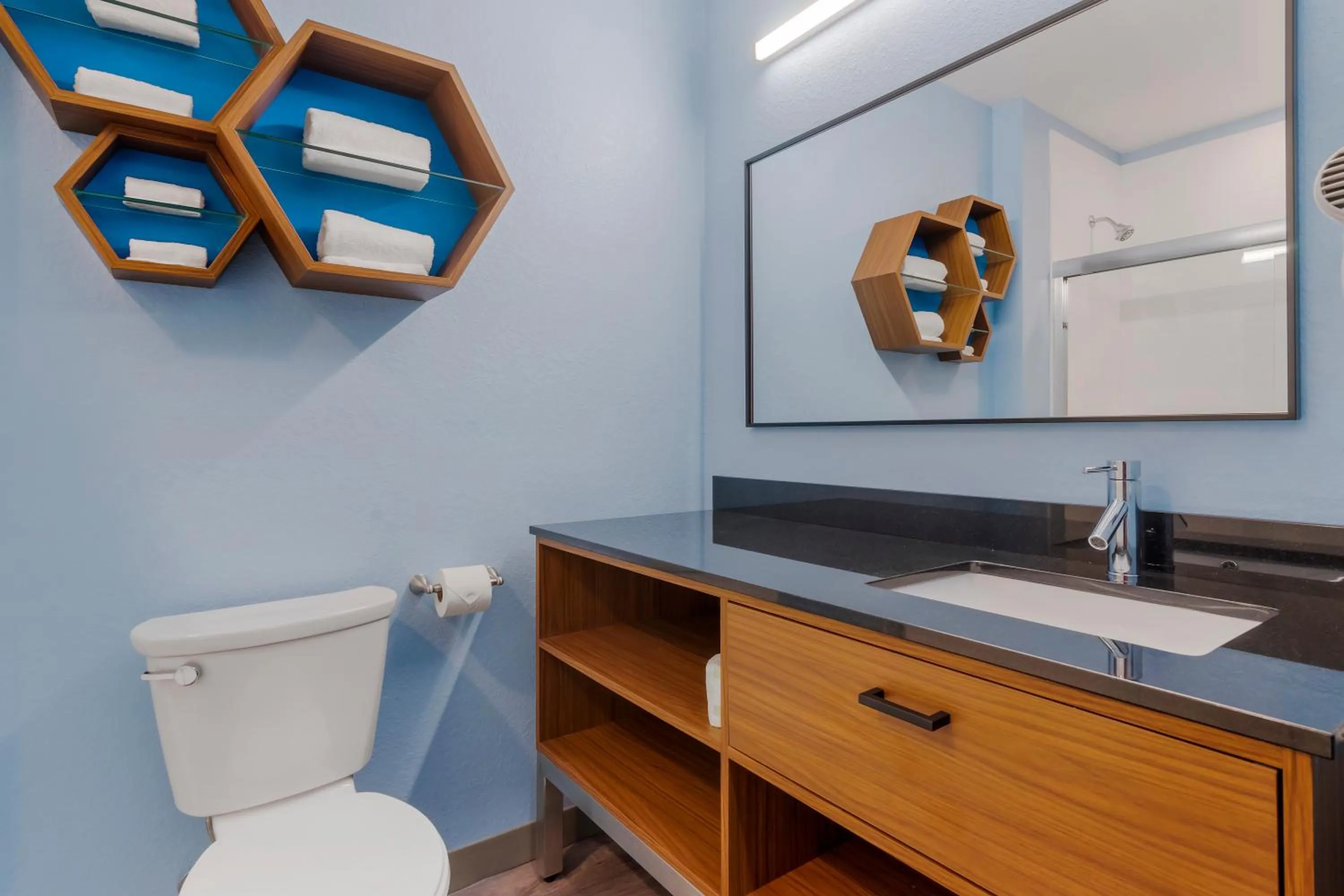 Bathroom in HomeTowne Studios by Red Roof Tampa - Airport
