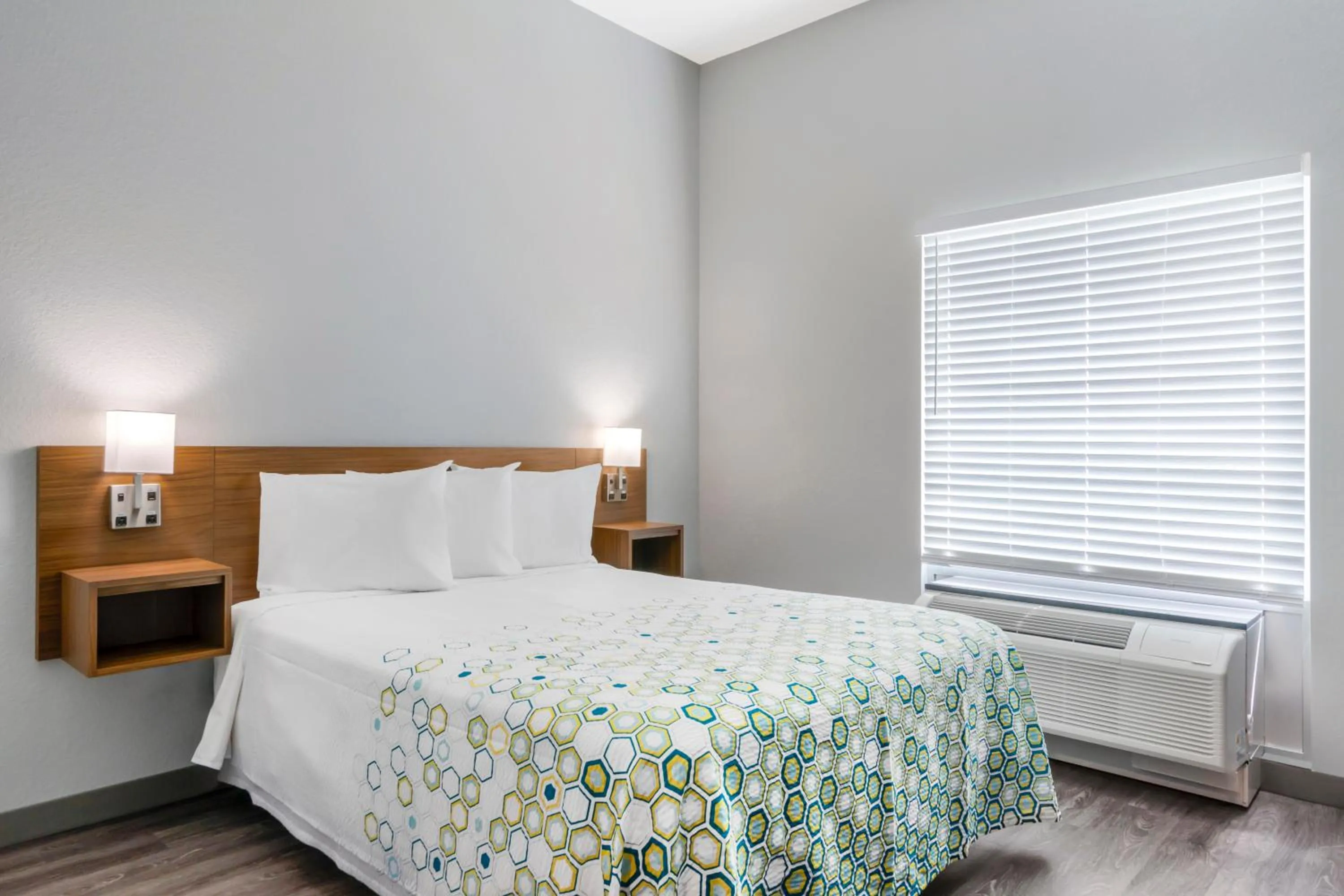 Bedroom, Bed in HomeTowne Studios by Red Roof Tampa - Airport